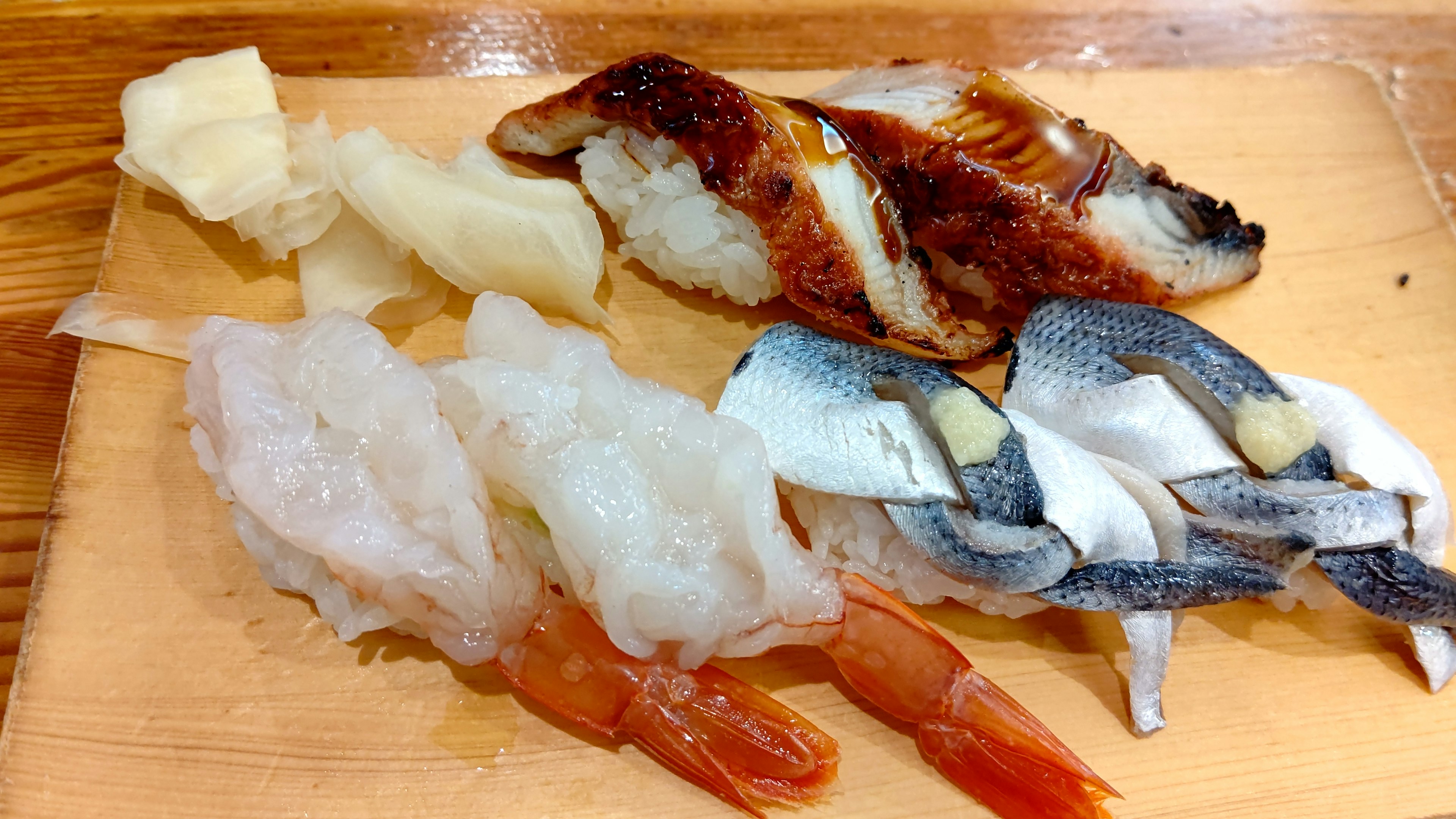 Assorted sushi featuring shrimp and white fish