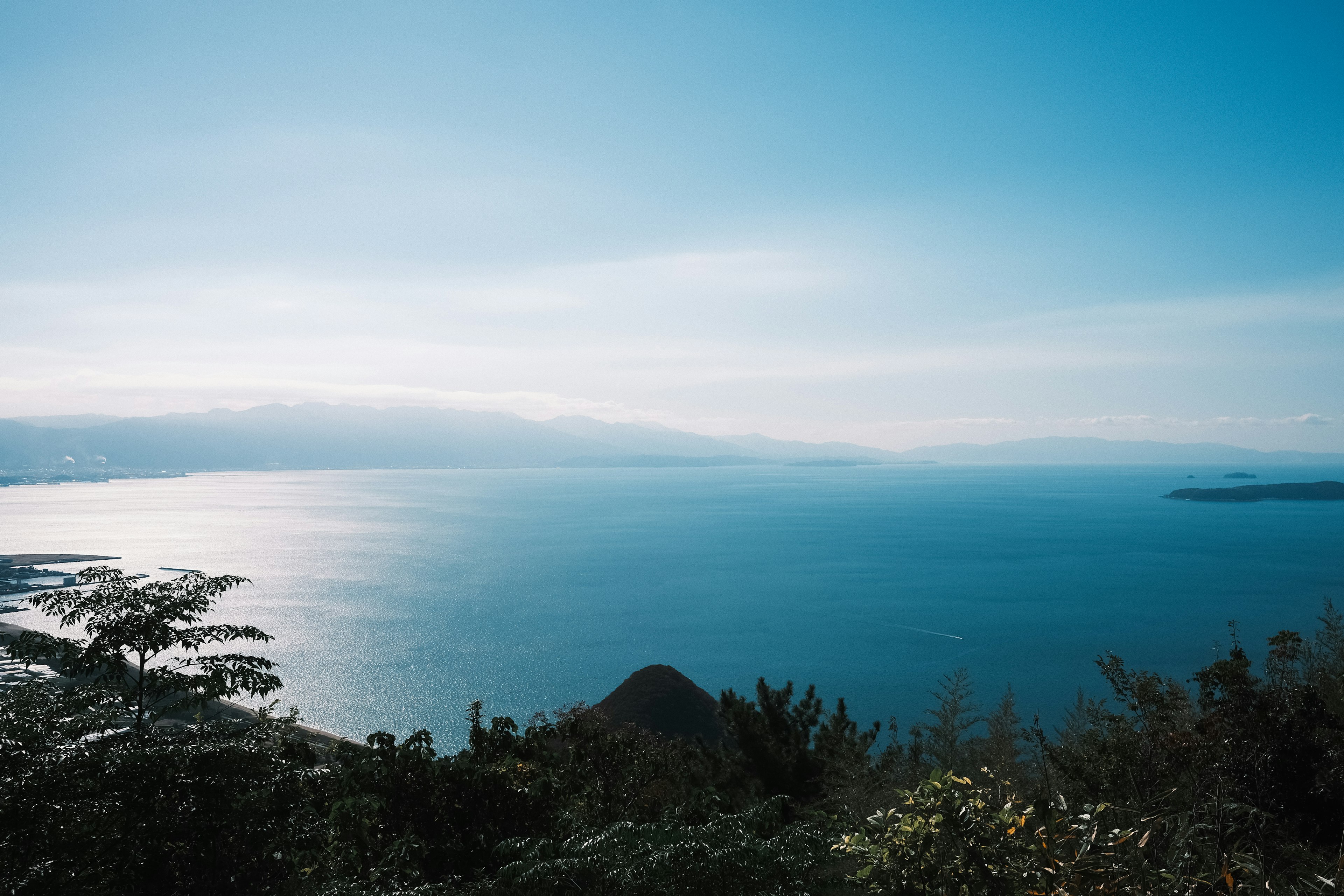 A serene landscape featuring blue sea and calm sky