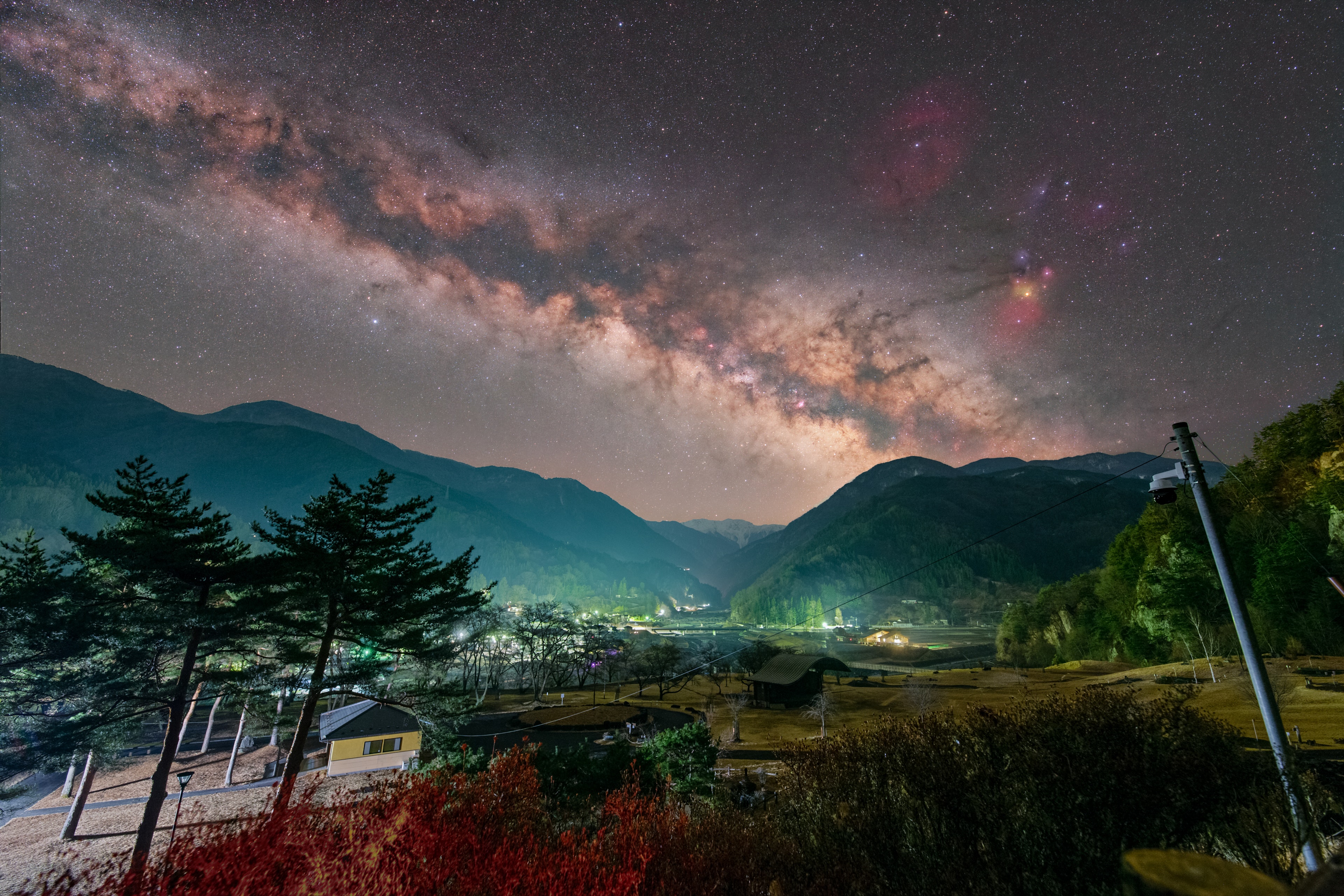 Stunning landscape featuring the Milky Way over mountains and a valley