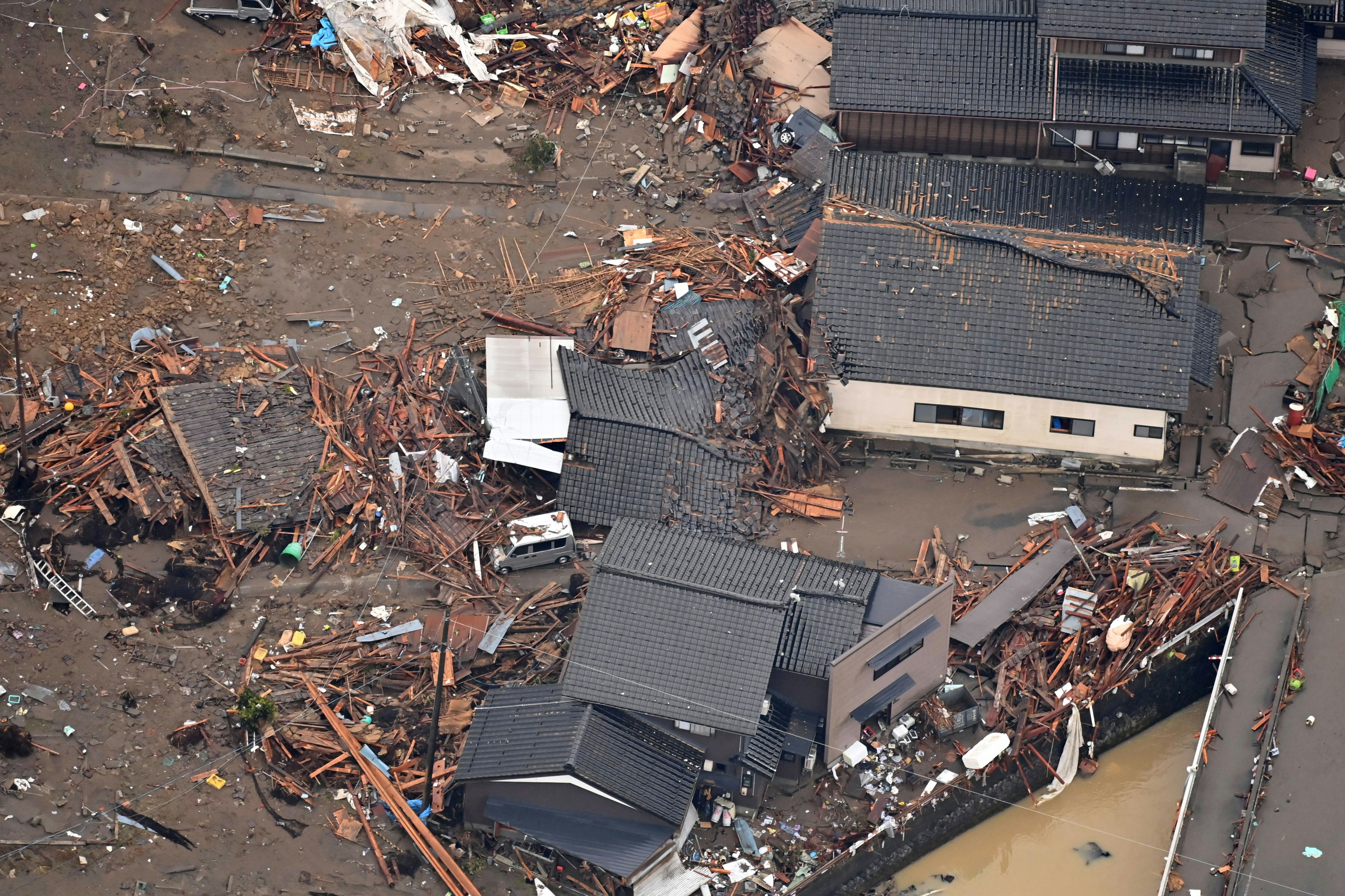 Aerial view of houses and debris devastated by flooding