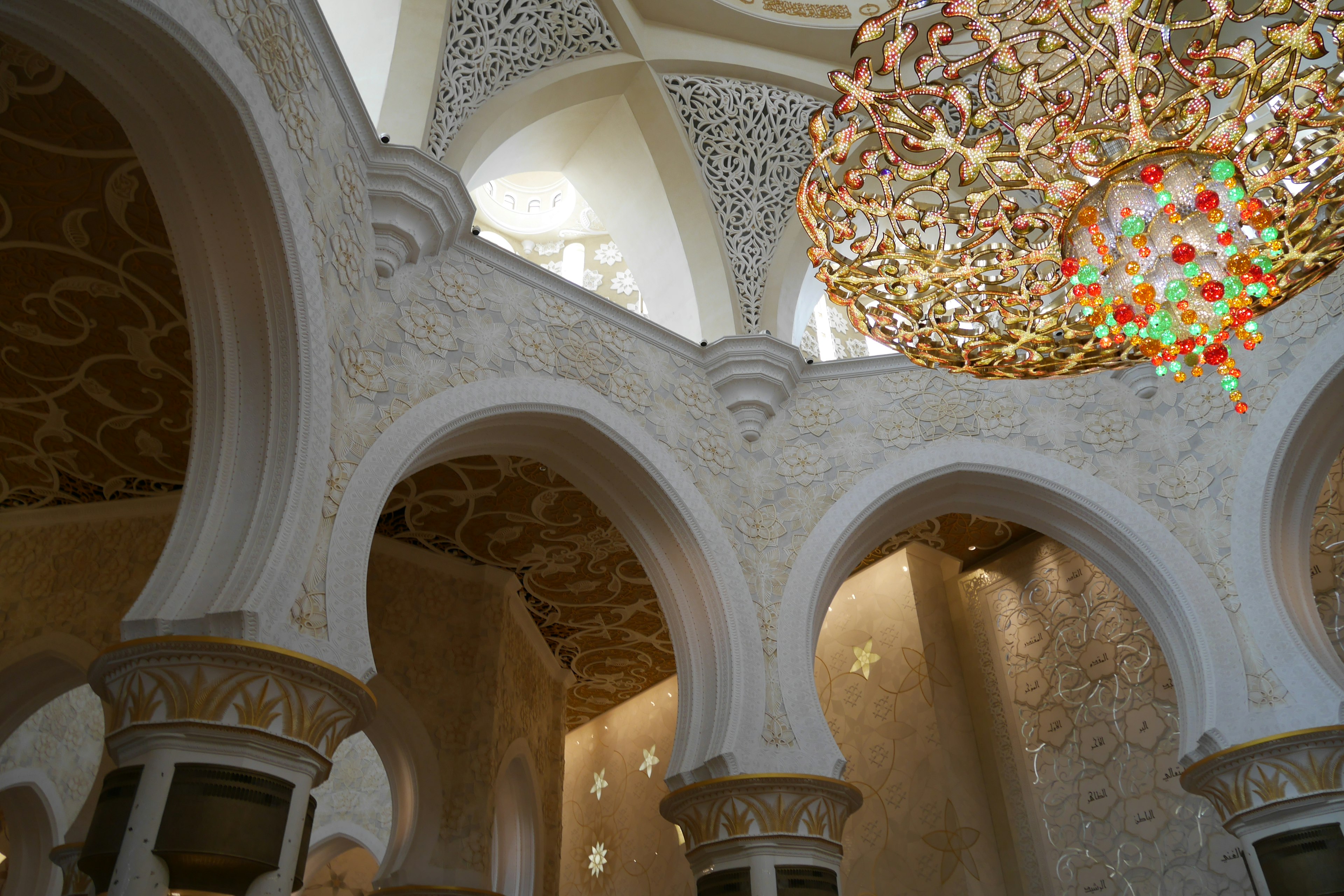 Interior view featuring ornate arches and a stunning chandelier