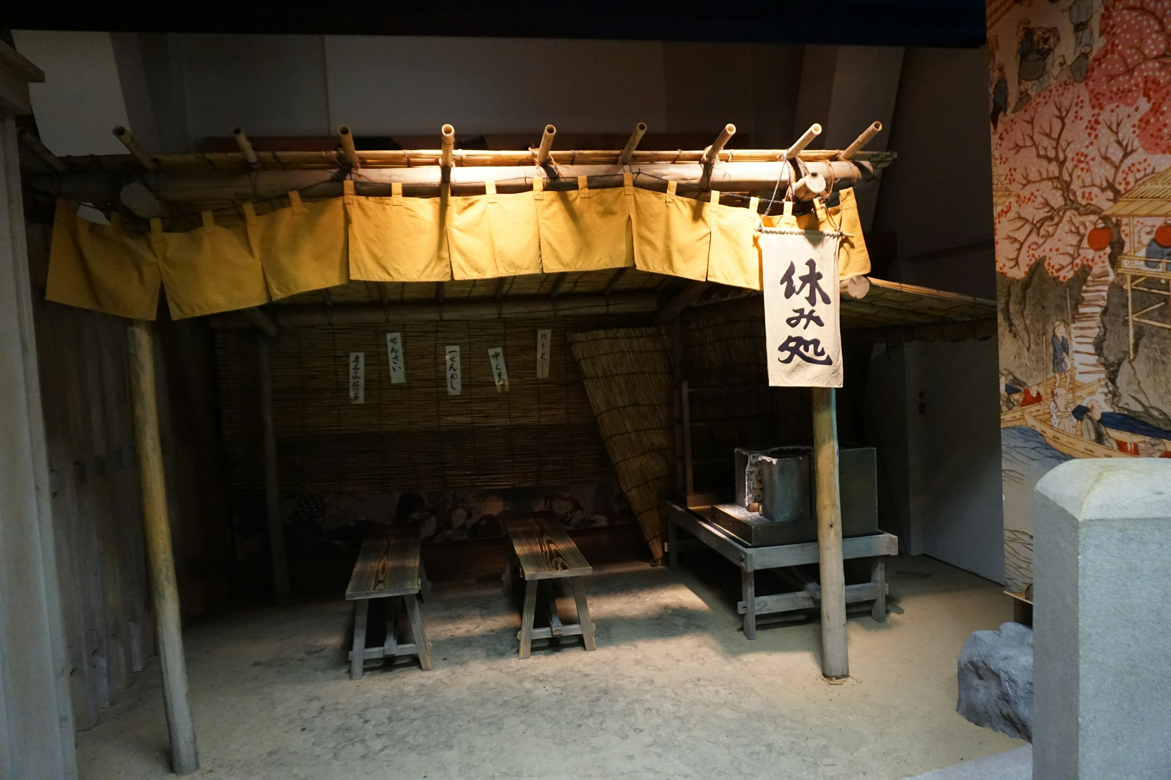 Interior of a traditional Japanese teahouse with wooden tables and chairs