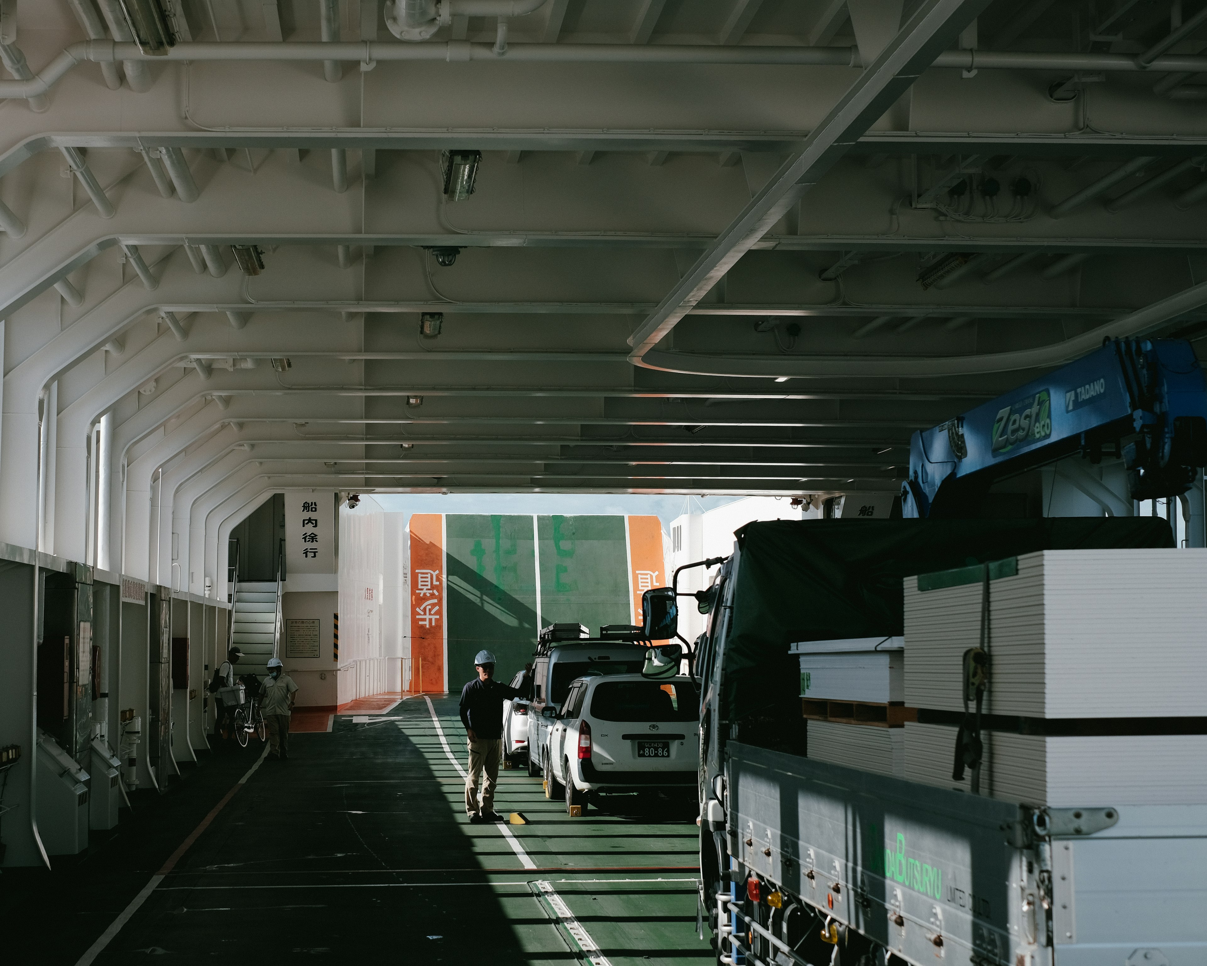 Interior of a ferry with vehicles lined up