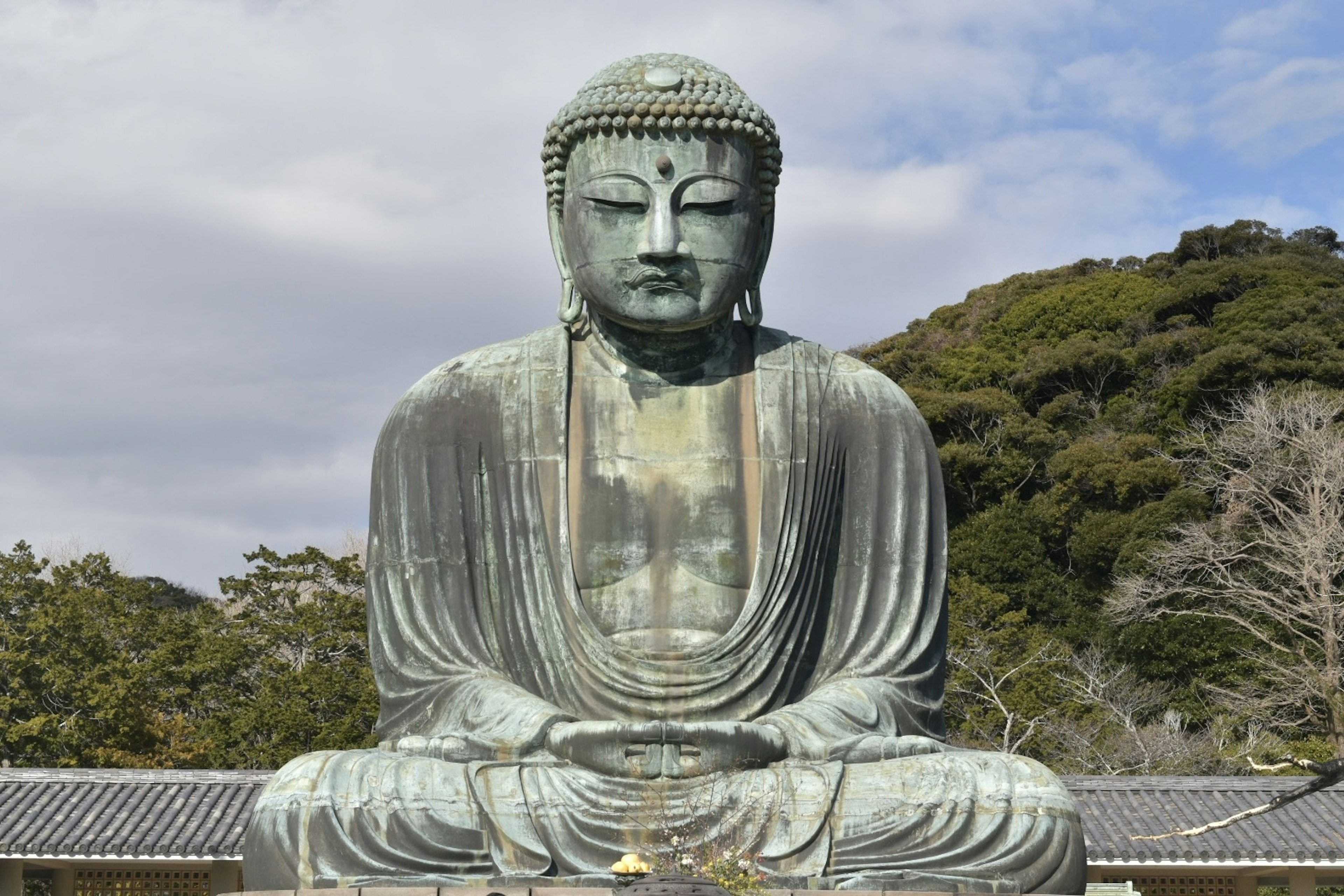 Bronze statue of the Great Buddha of Kamakura seated in nature