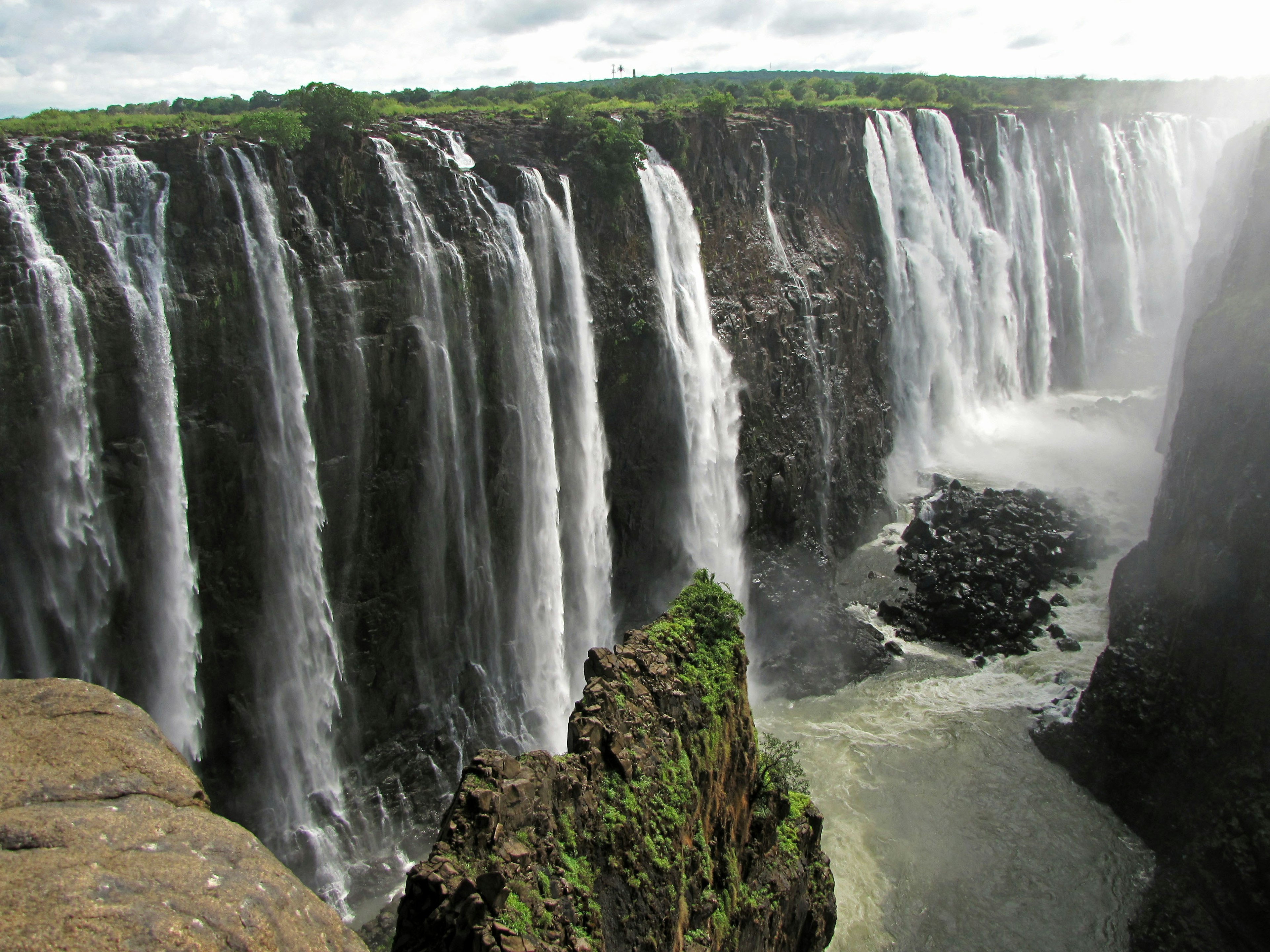 Majestic waterfall surrounded by lush greenery