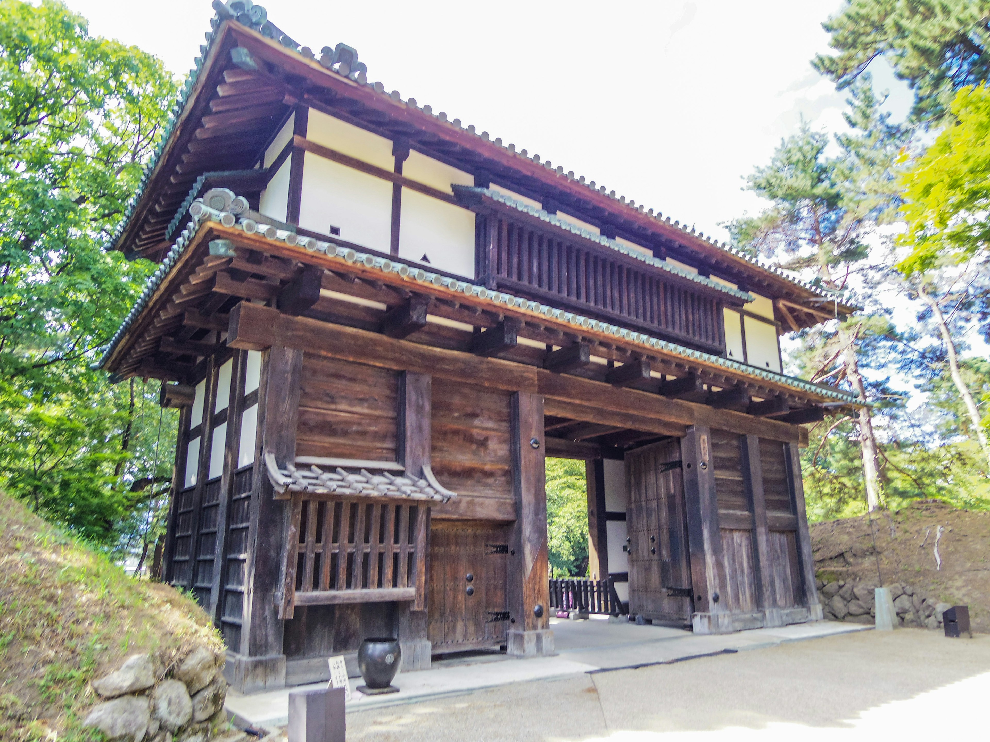 Traditional Japanese wooden gate structure and design visible