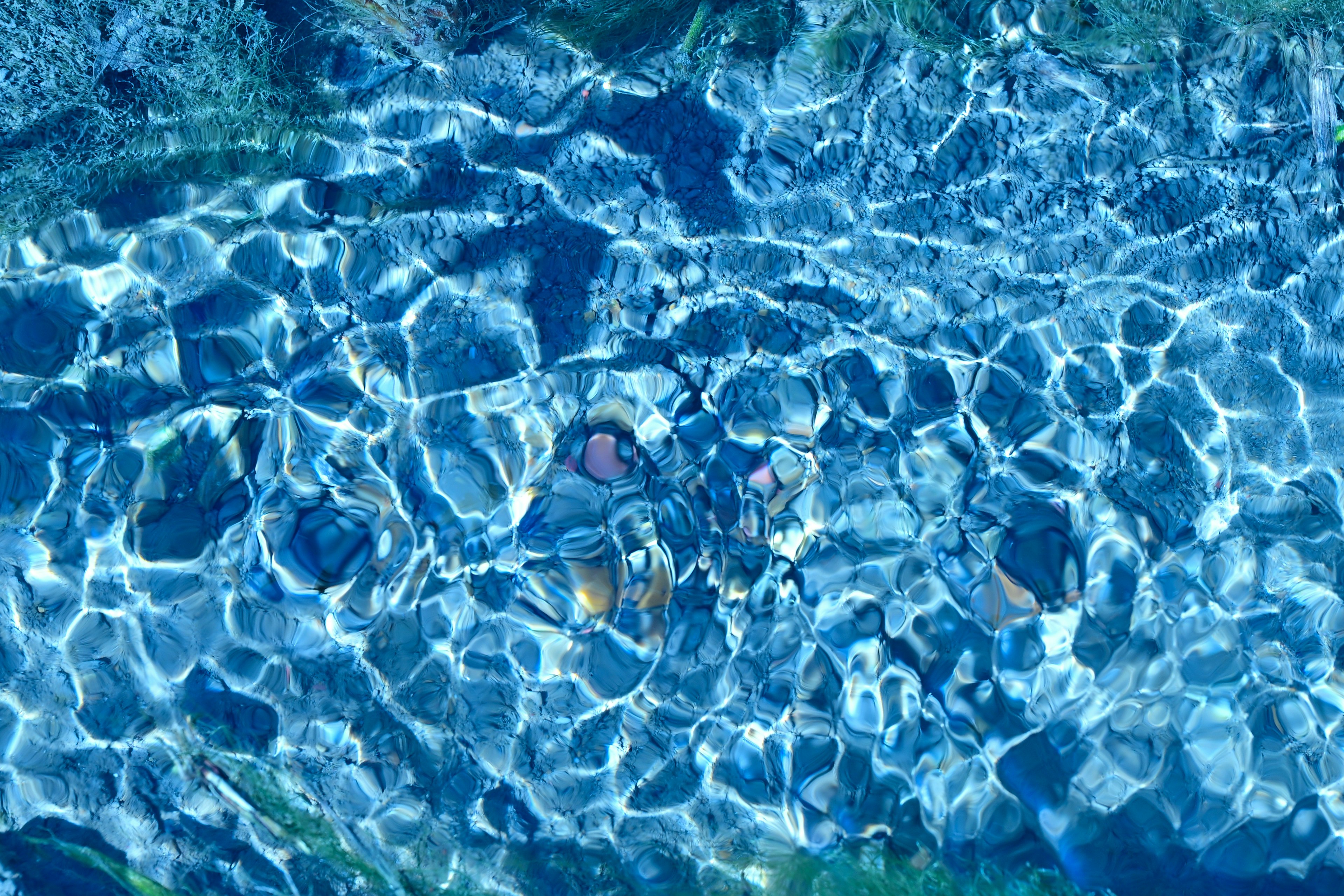 Image showing rippling blue water with visible stones beneath