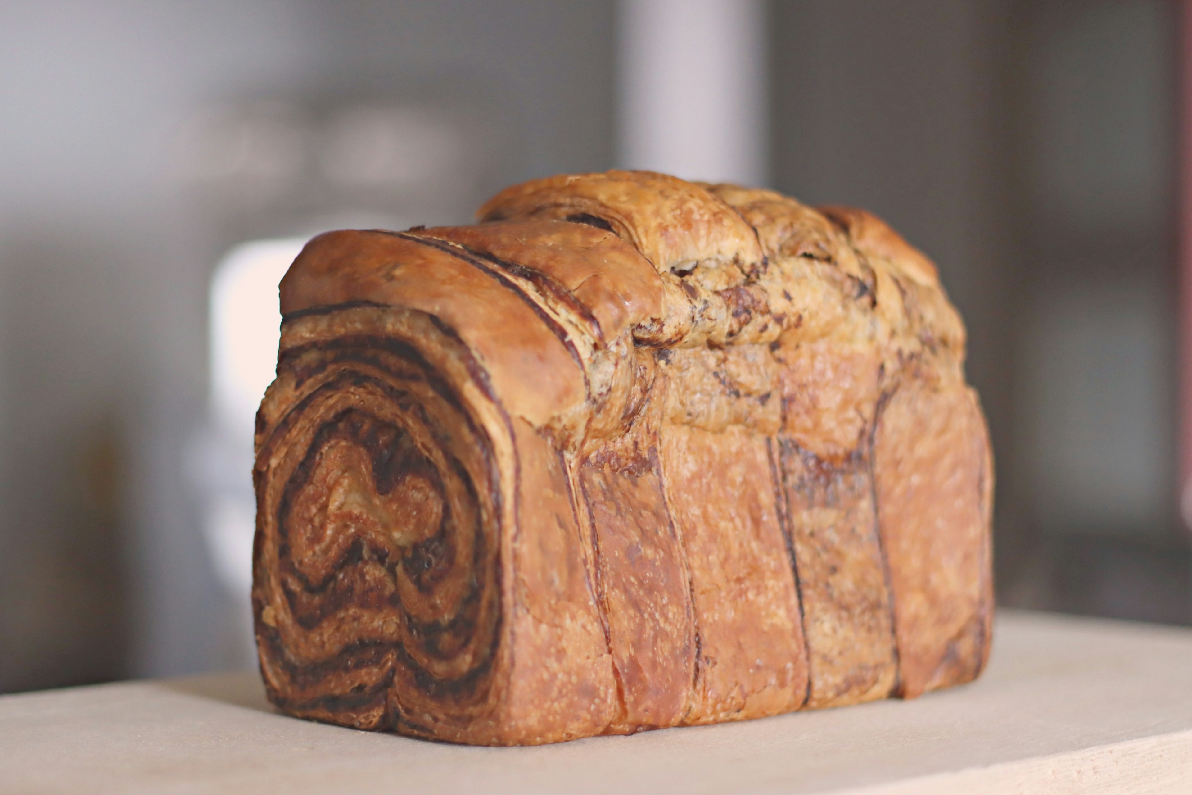 A delicious chocolate marble bread sitting on a wooden counter