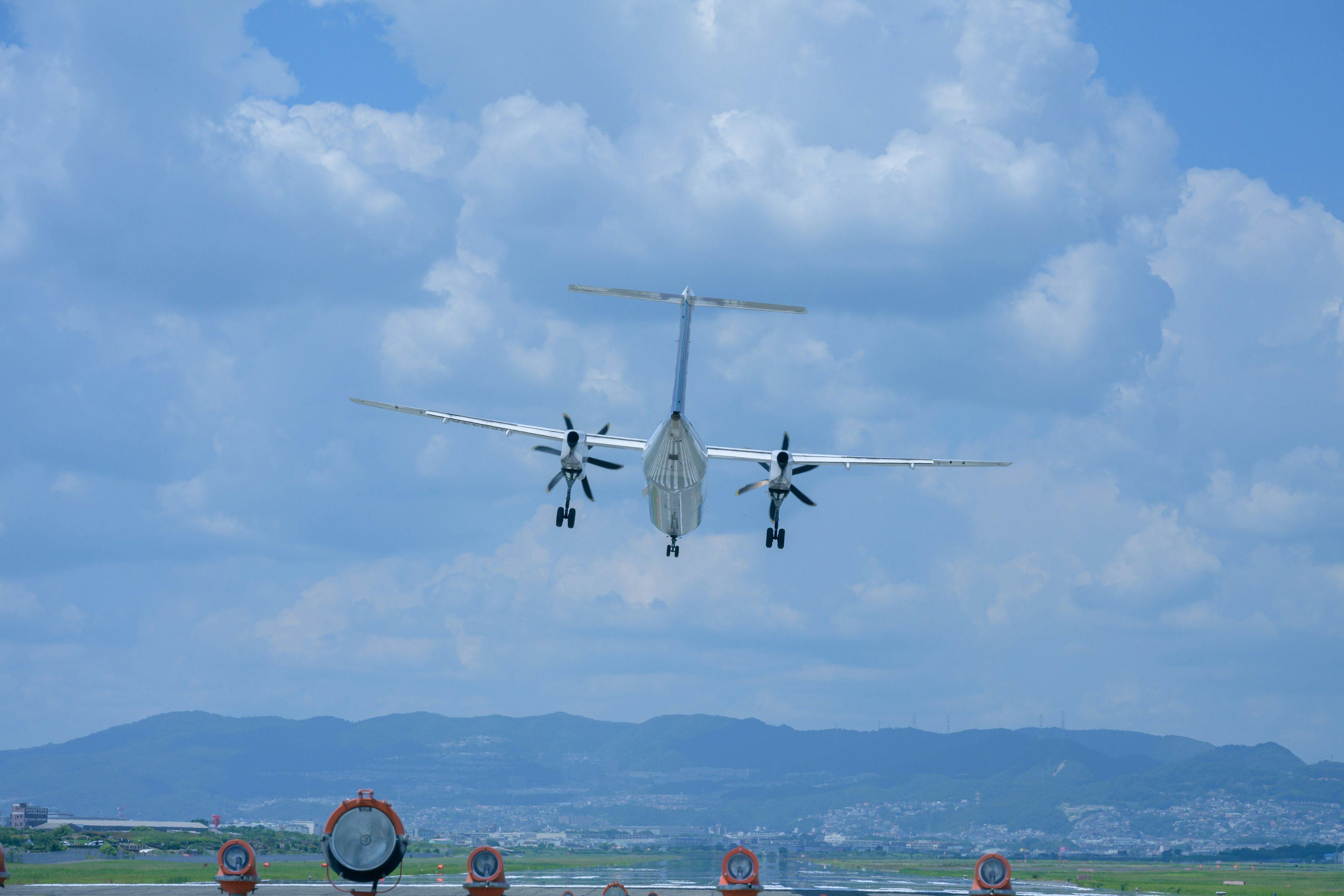 Propeller aircraft taking off at an airport