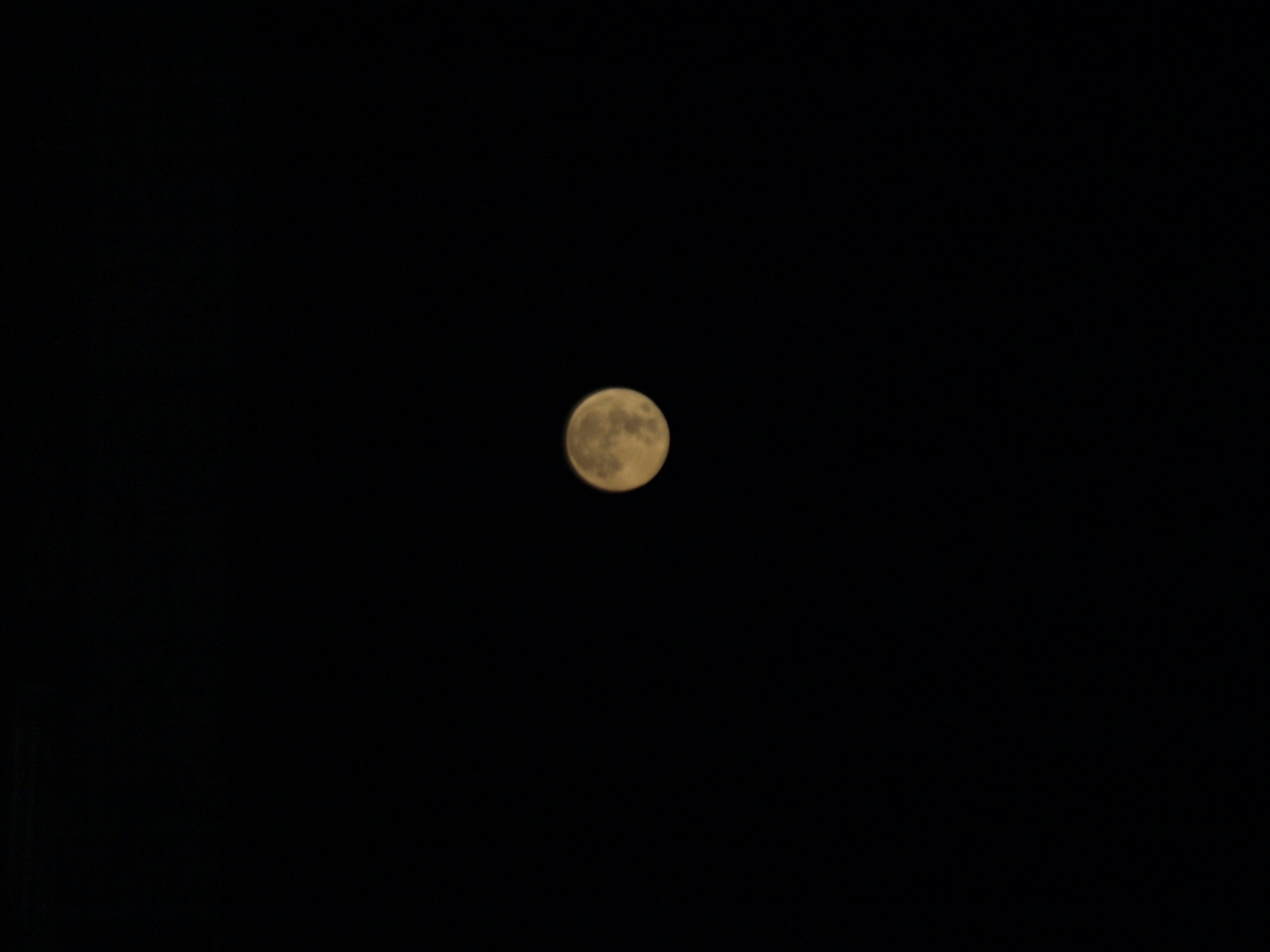 Bright full moon against a dark background