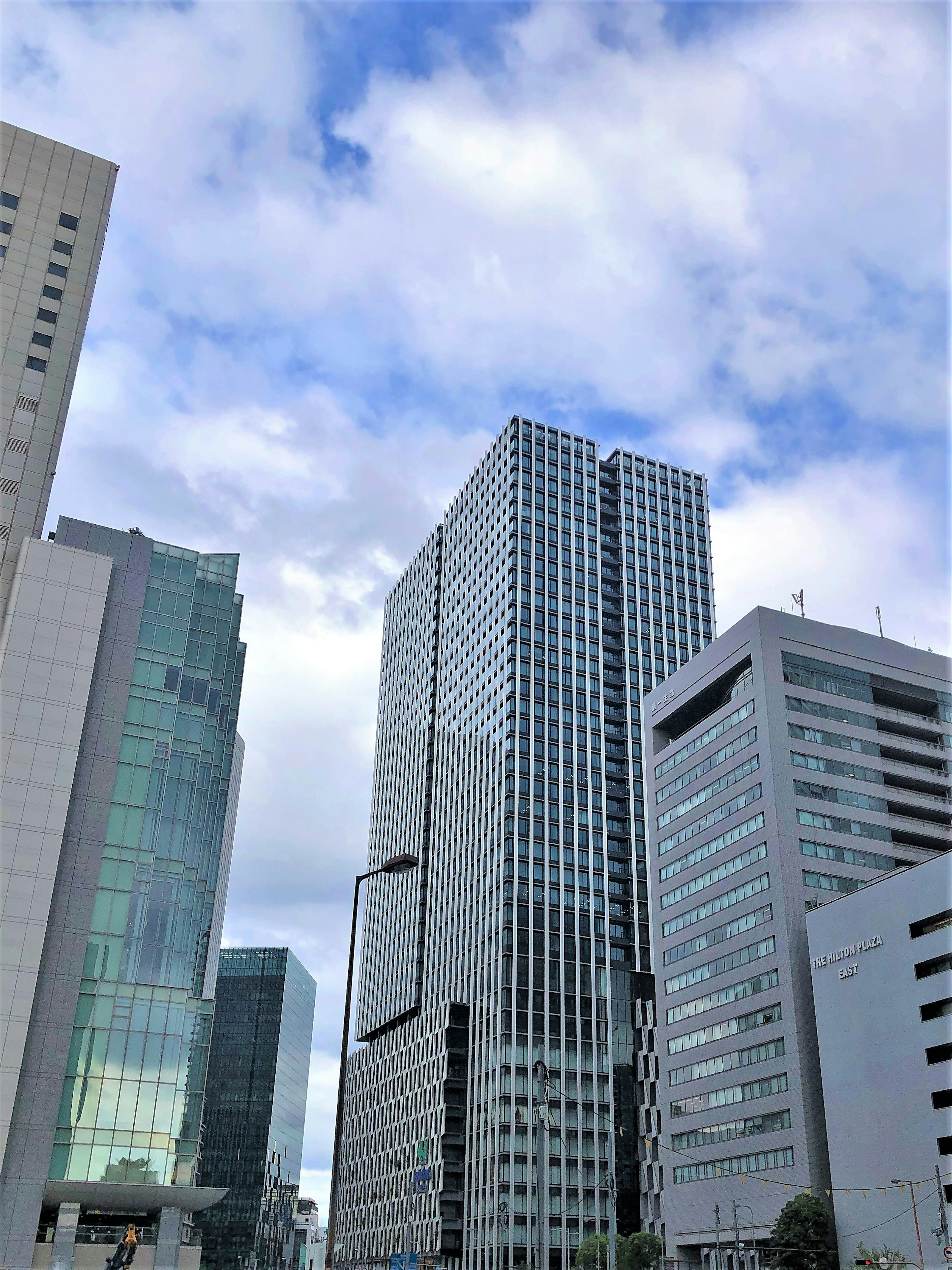 Urban skyline featuring tall buildings and blue sky