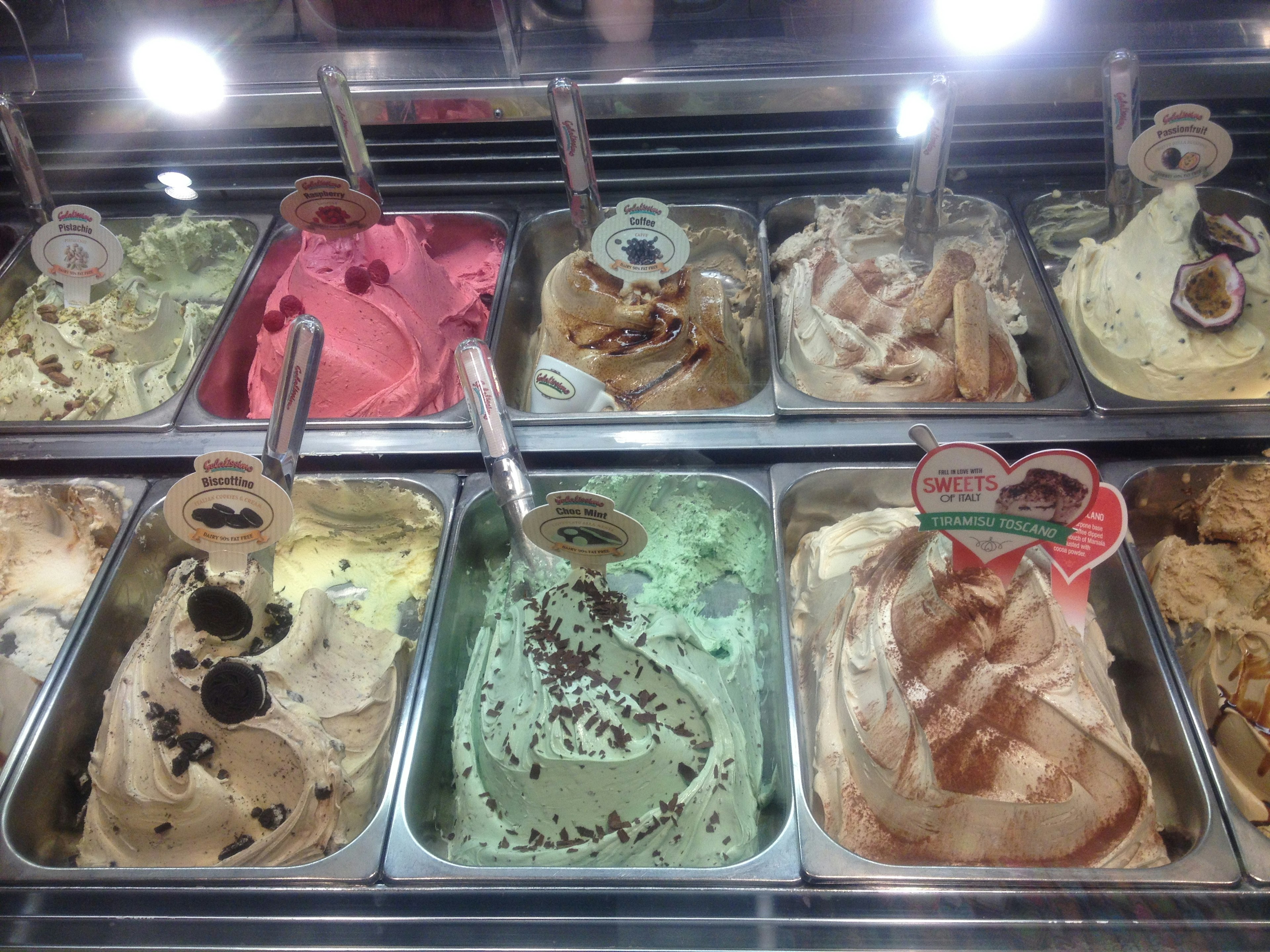 Colorful assortment of gelato flavors displayed in a showcase