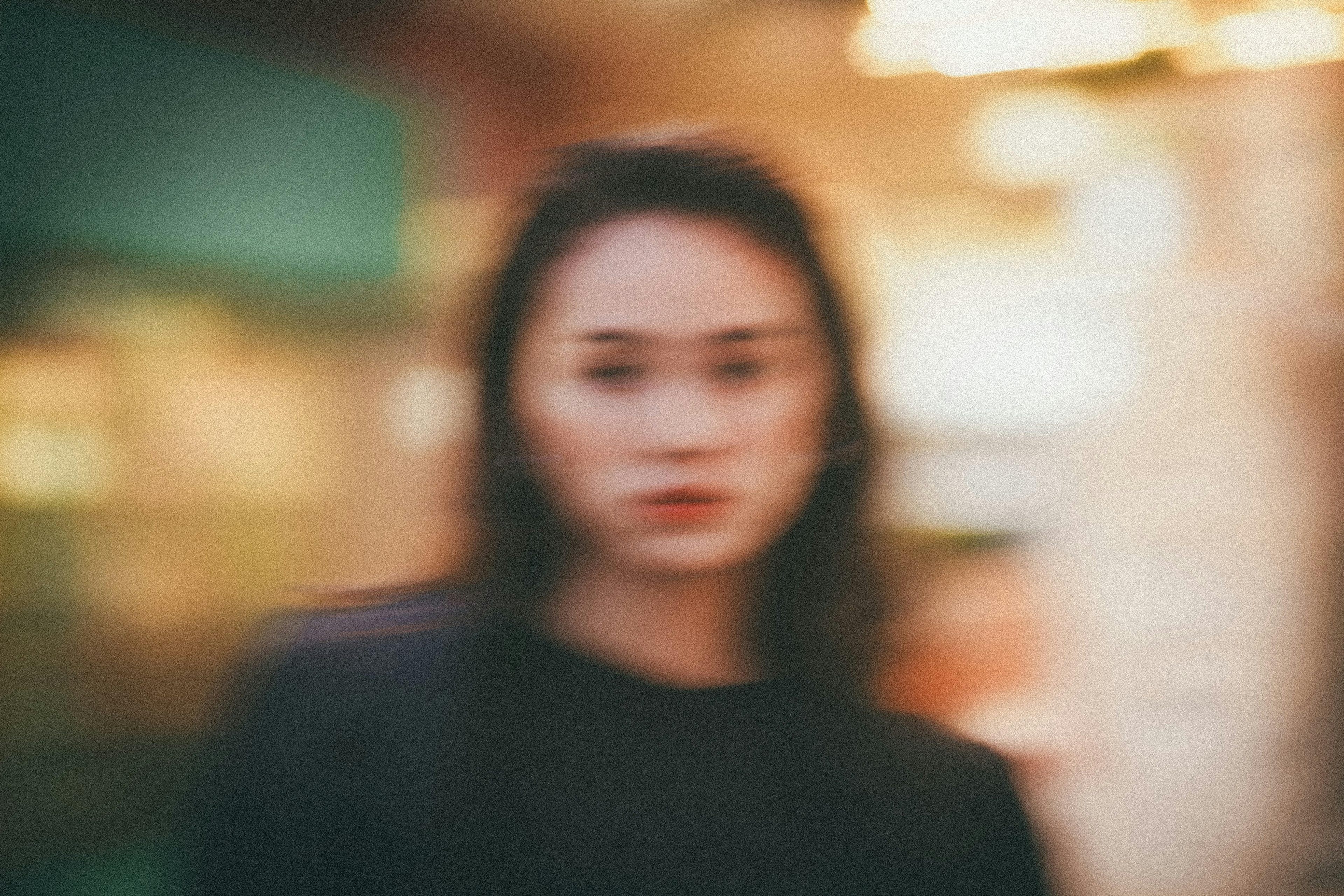 Portrait of a woman standing with a blurred background