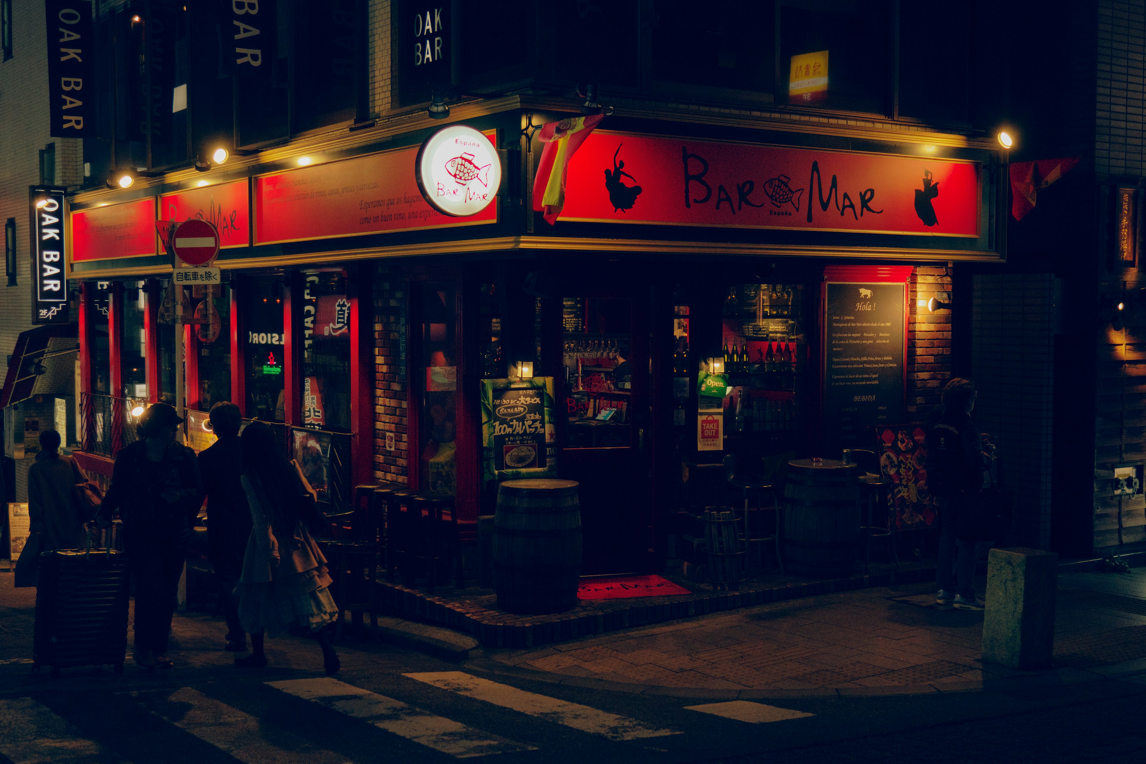 A red-themed pub illuminated at night