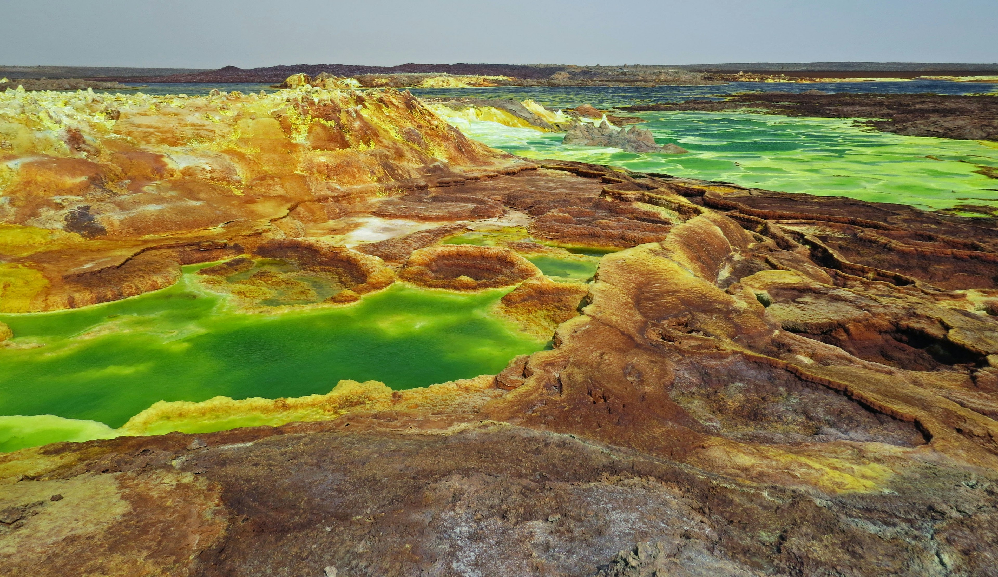 Dallol landscape featuring unique green lakes and colorful terrain