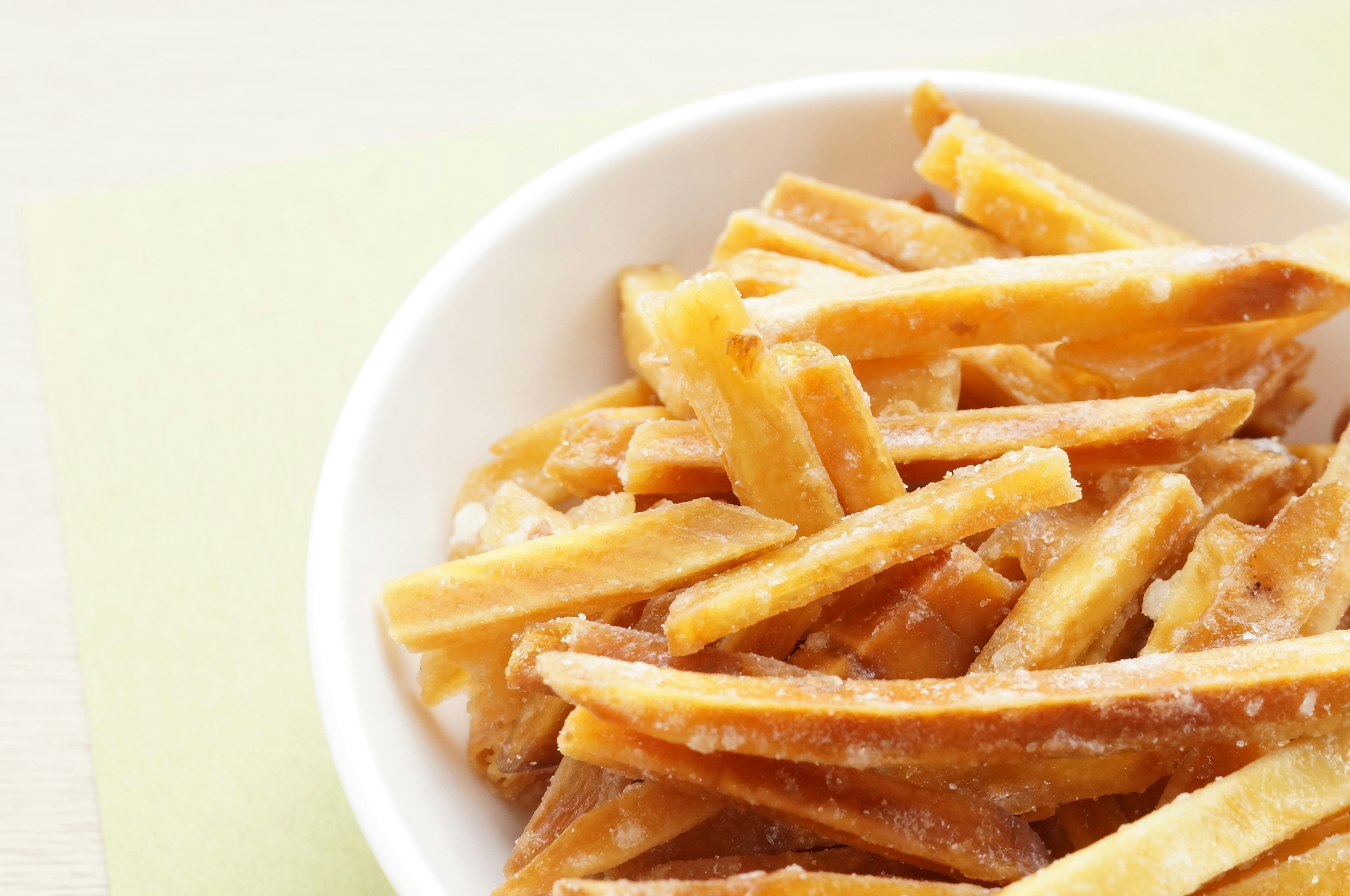 Crispy french fries in a white bowl