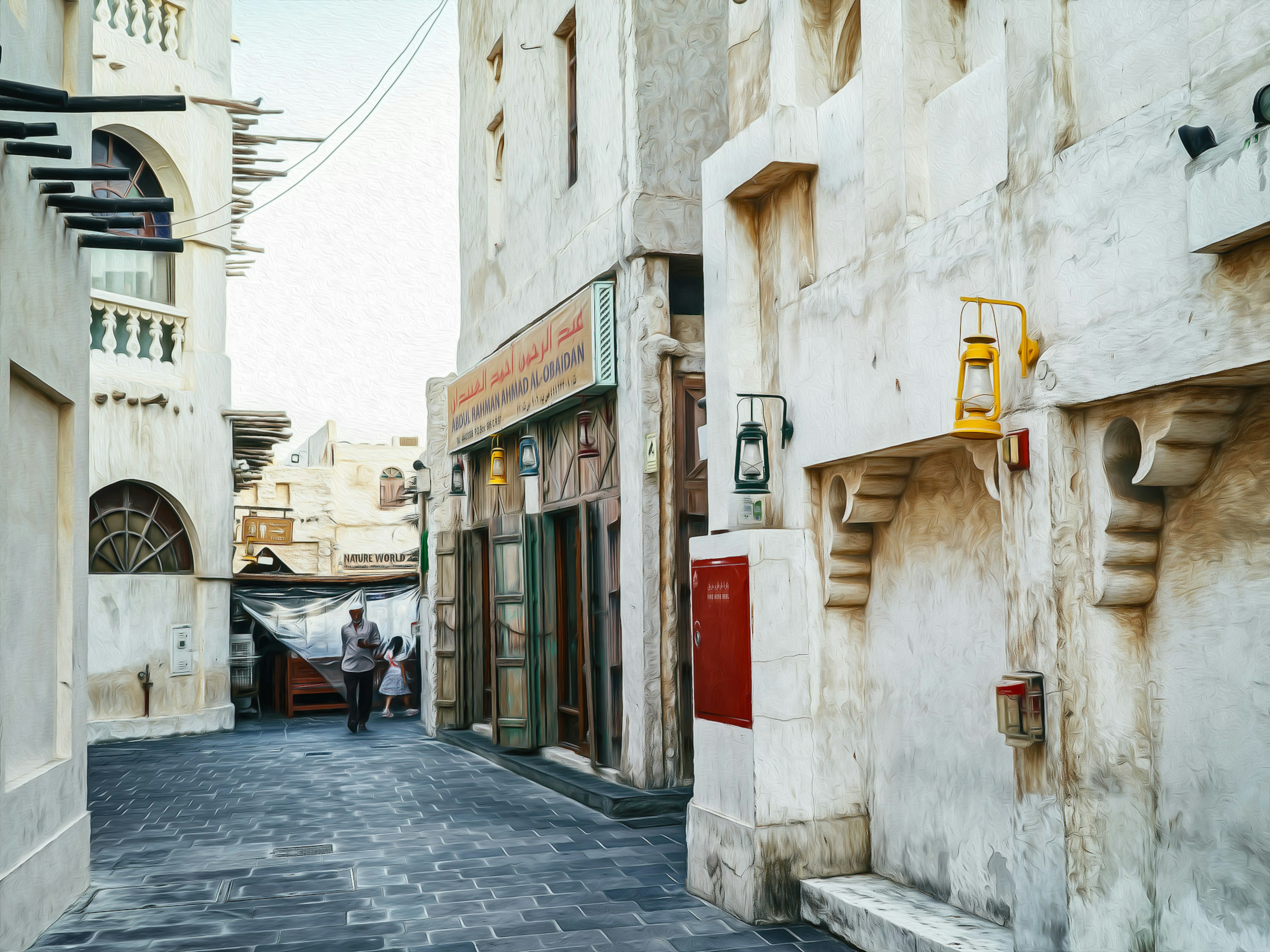 Narrow alley with white buildings and a person walking