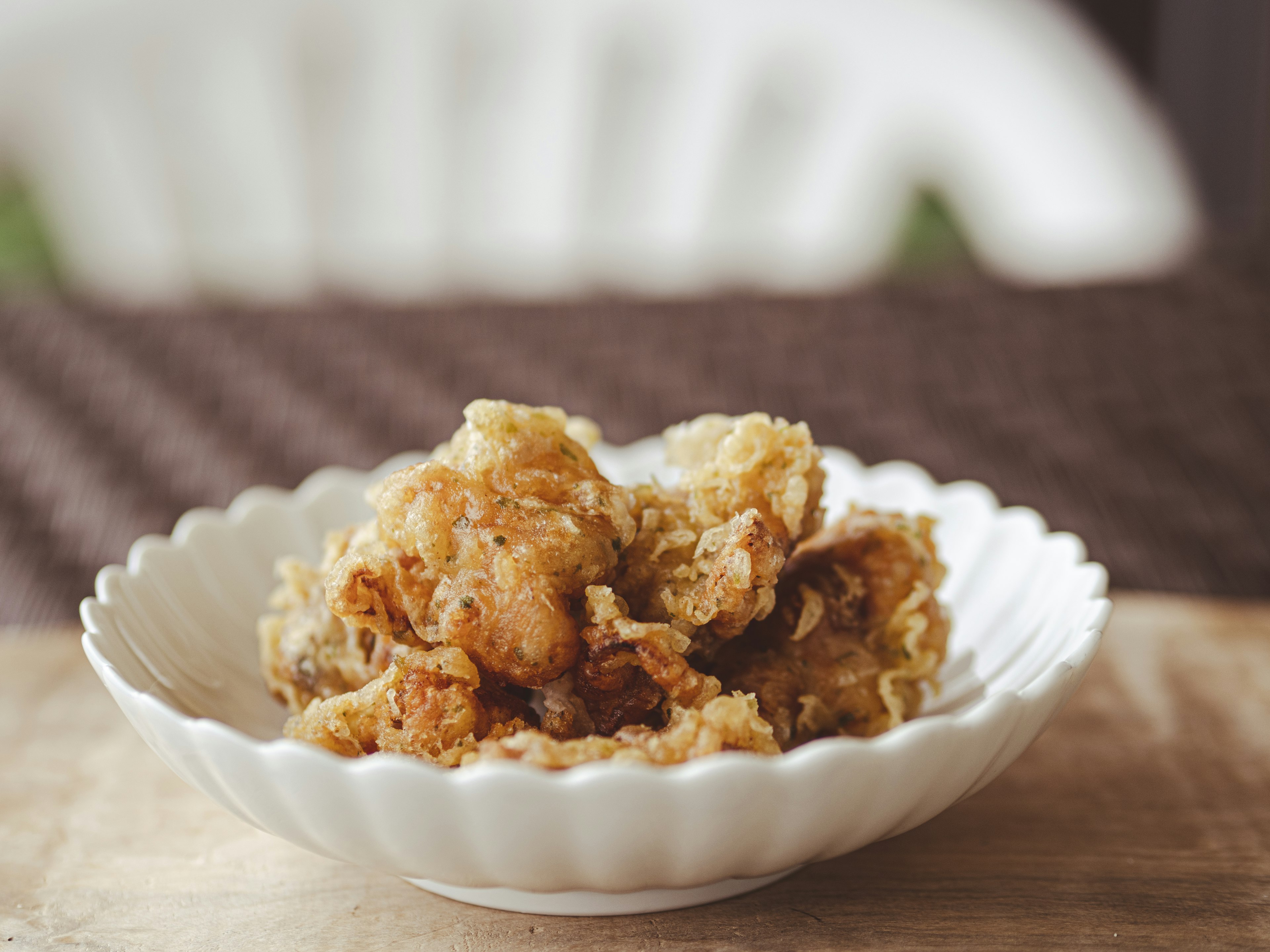 Fried chicken served in a white dish