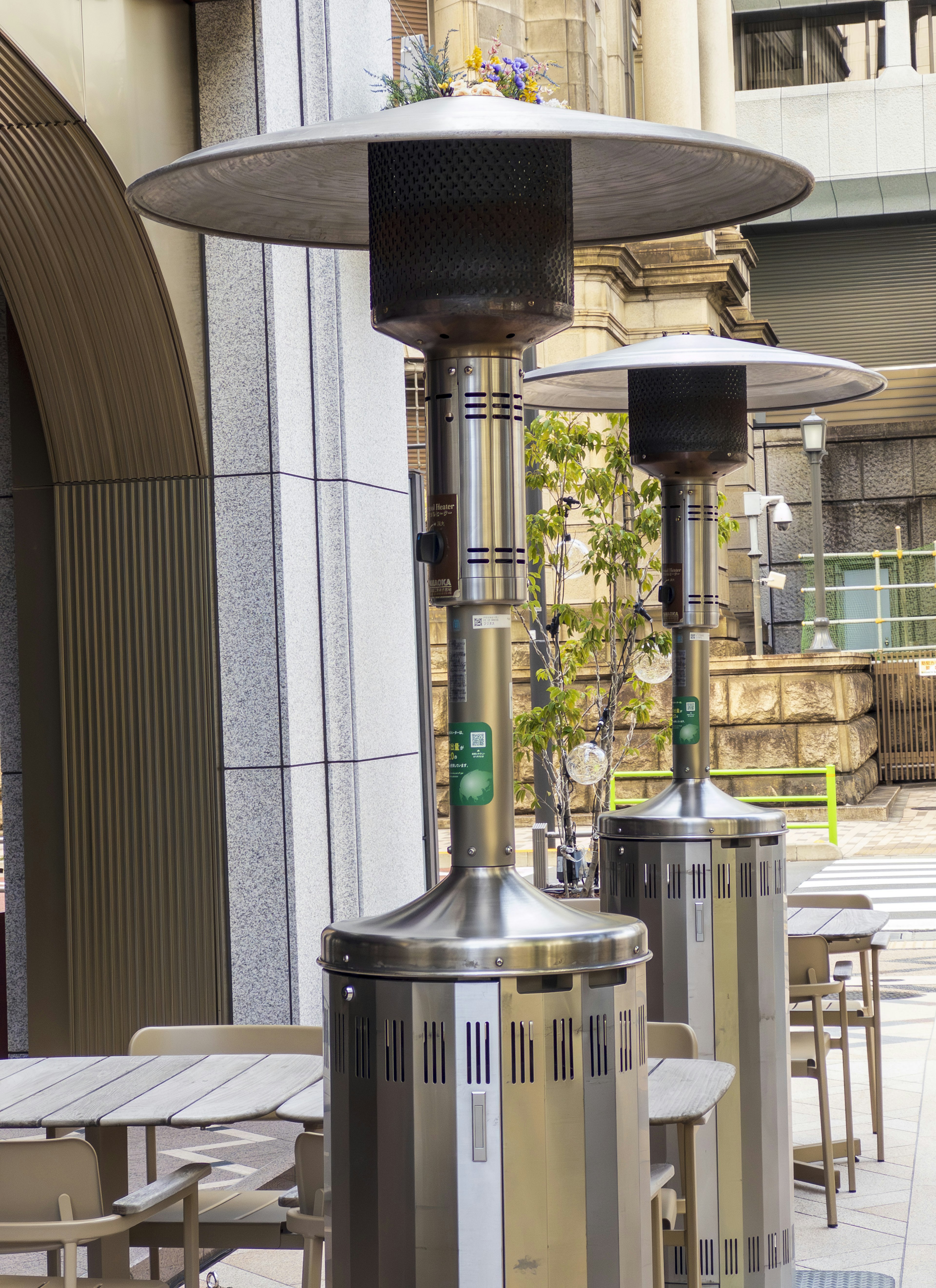 Outdoor heating lamps on a cafe terrace