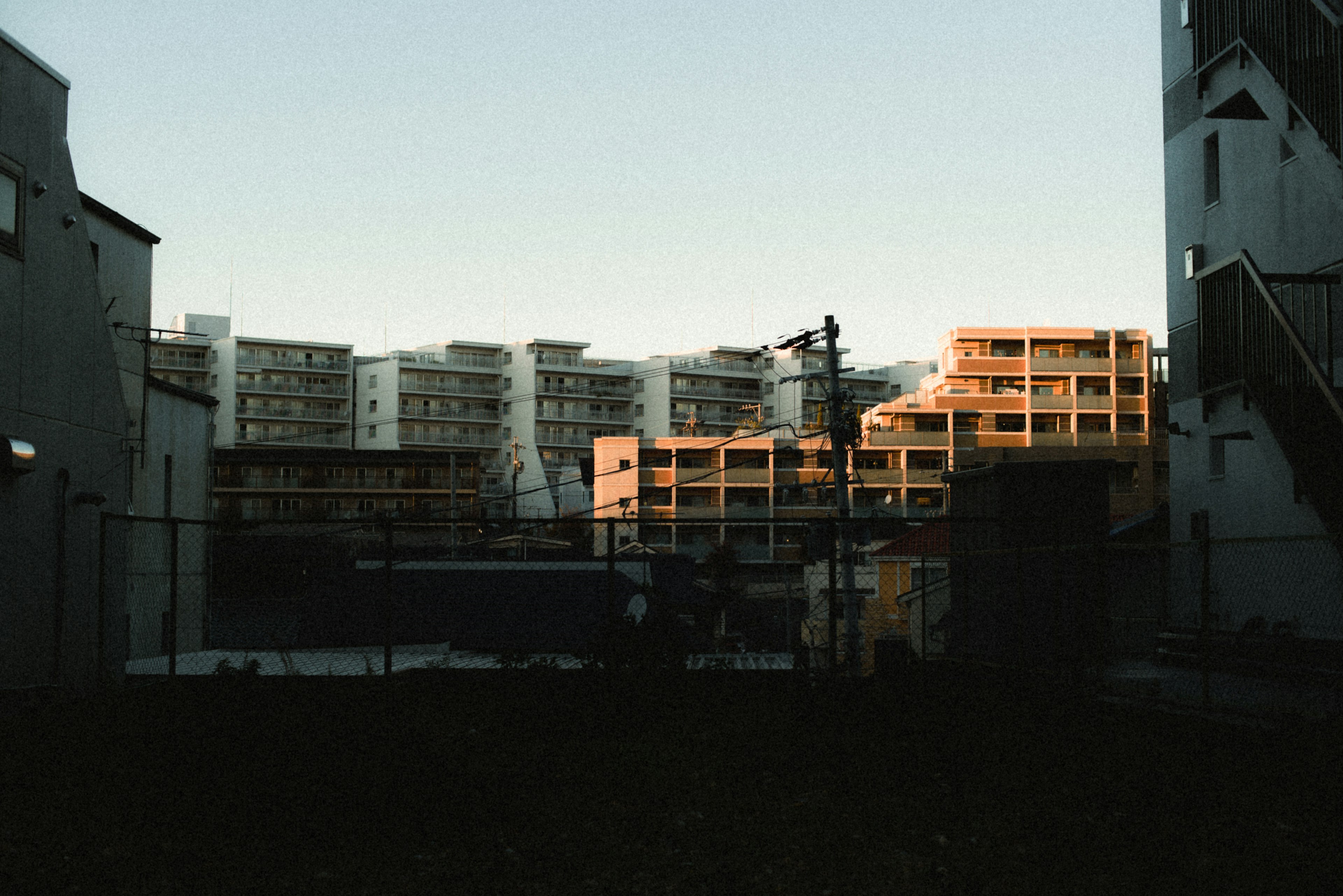 Urban landscape at dusk featuring high-rise buildings