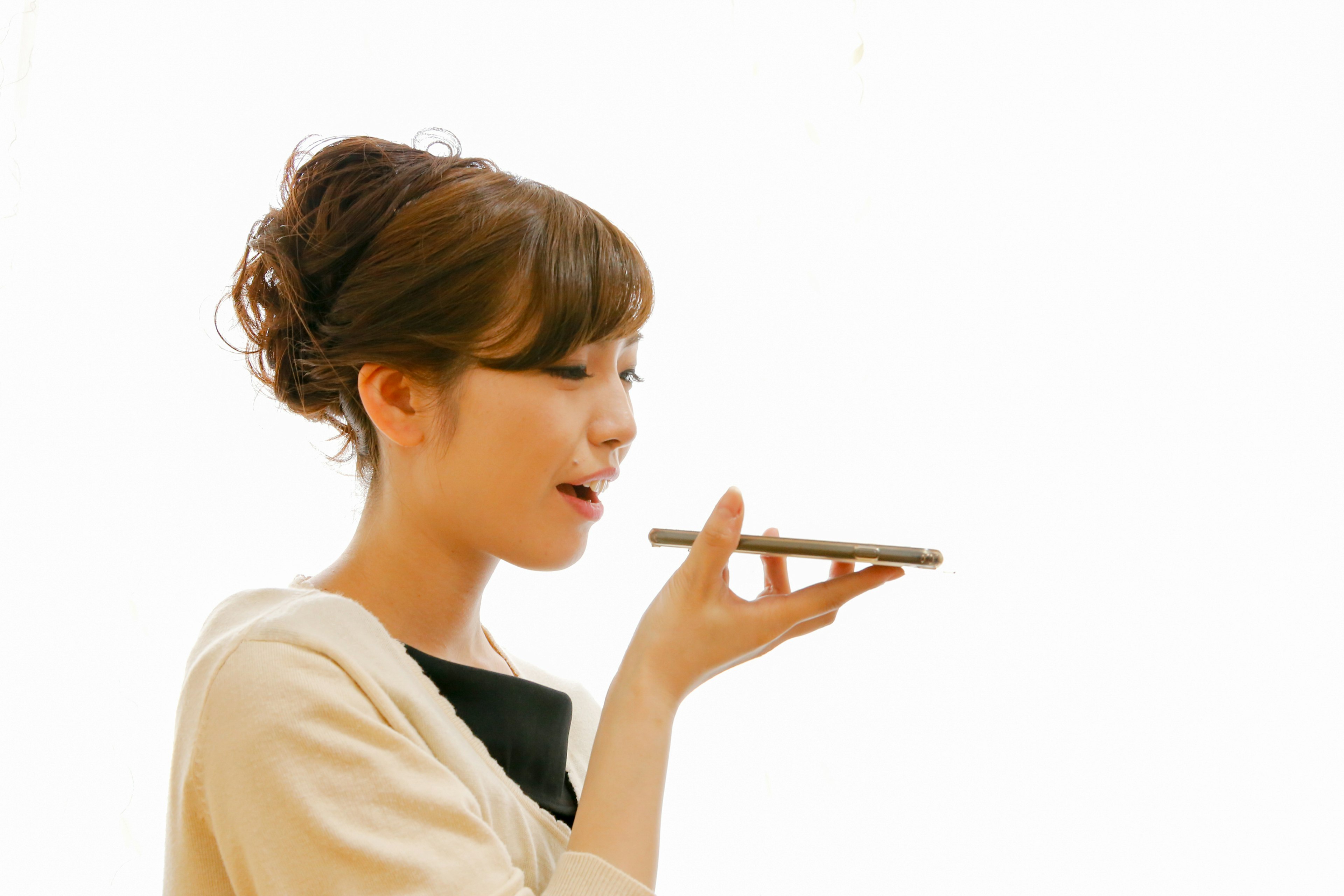 A woman using voice command on a smartphone