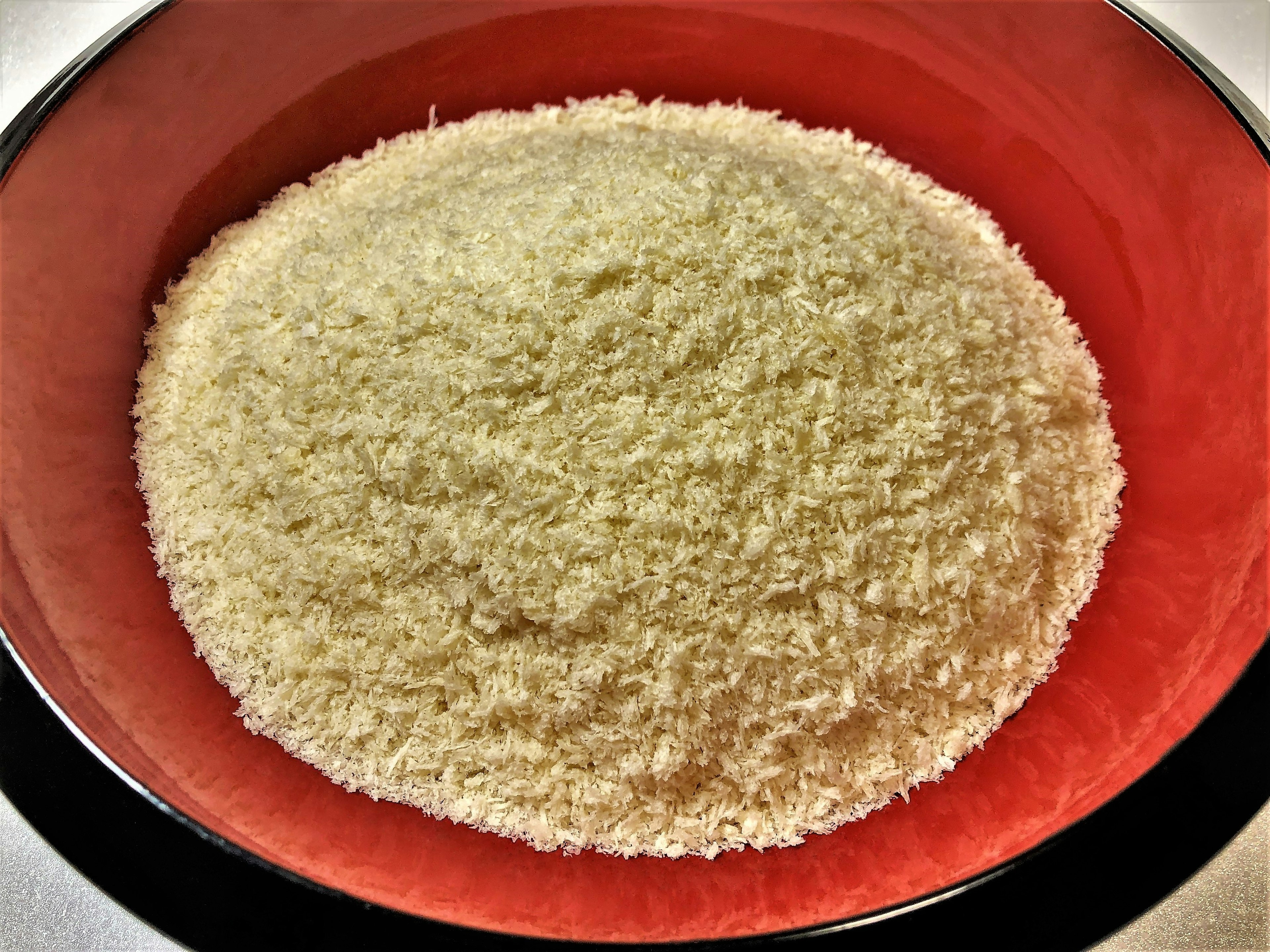 Fine white rice flour in a red bowl