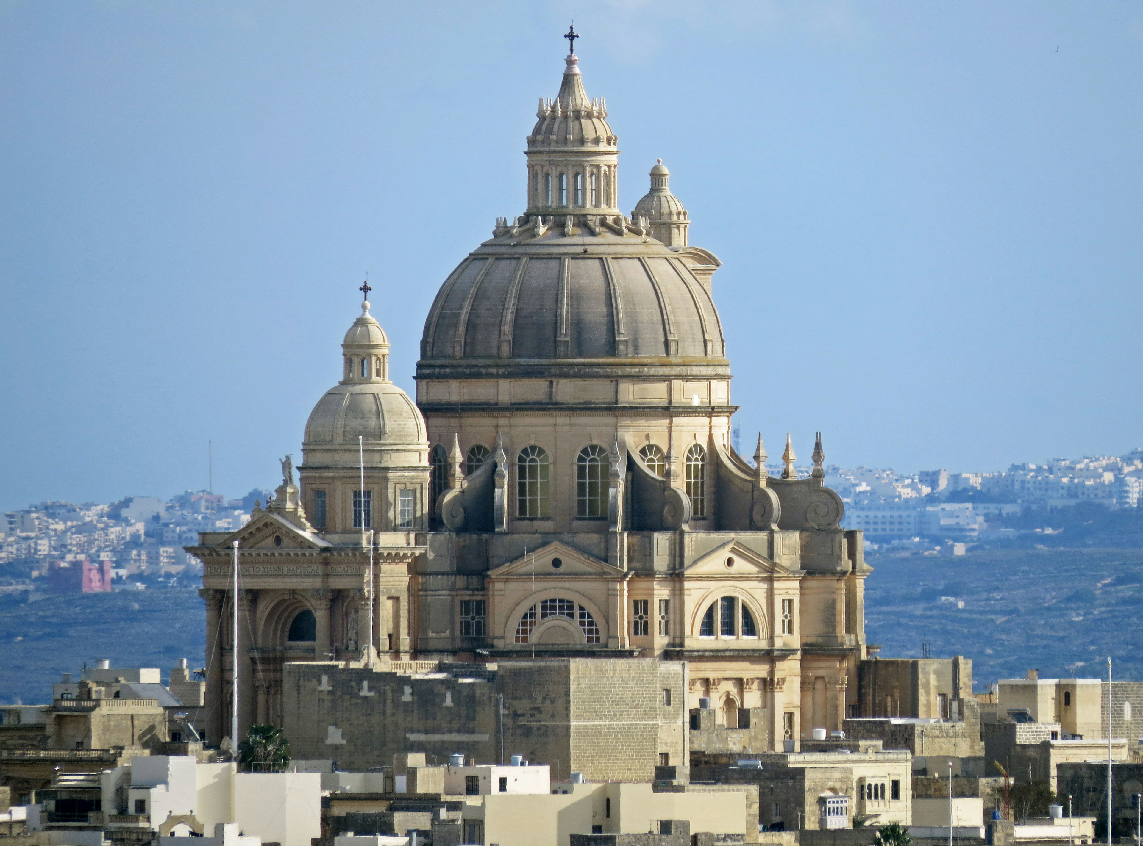 Beautiful dome-shaped church in Valletta with surrounding buildings