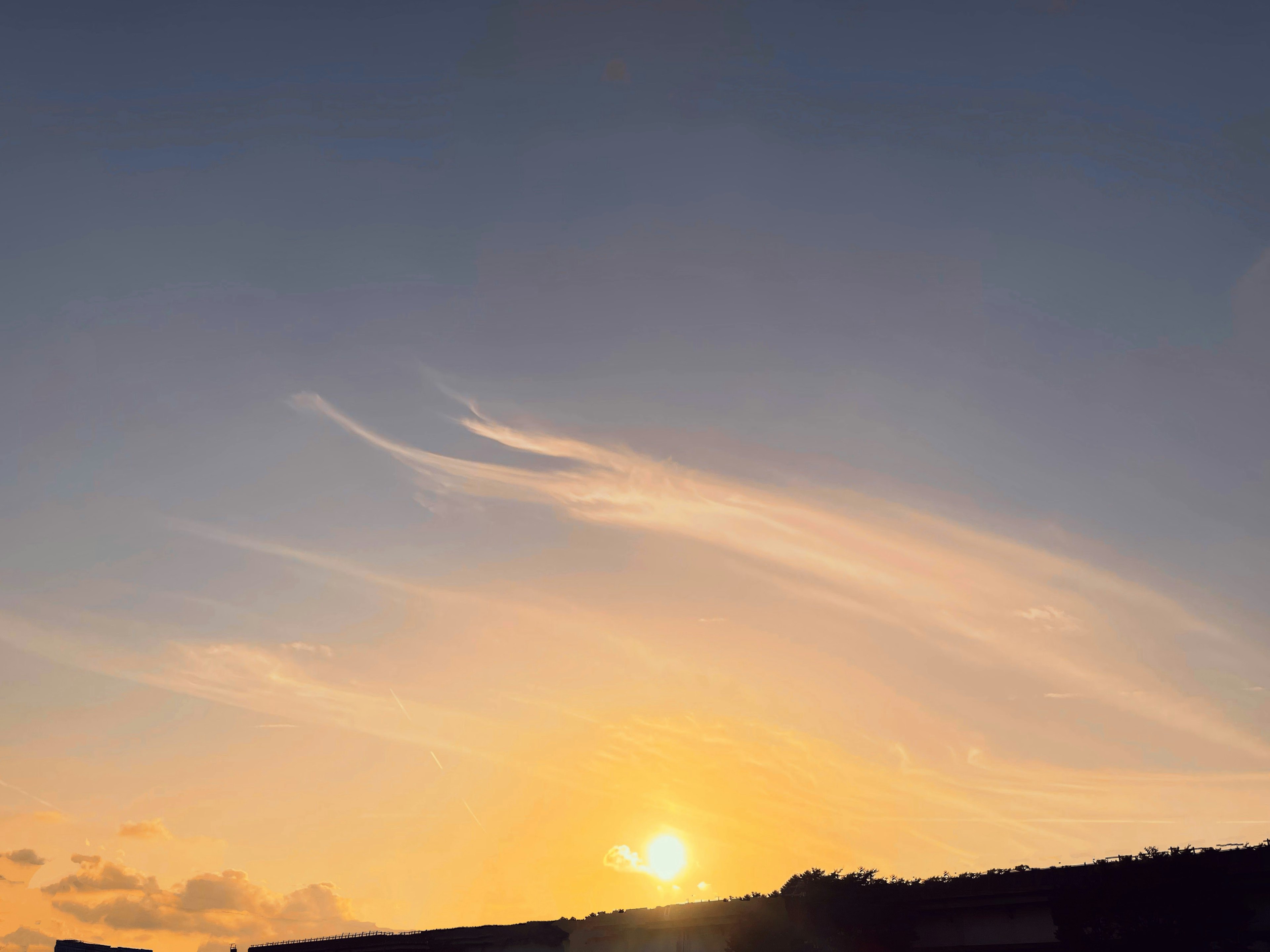 Beautiful sky with a sunset and wispy clouds