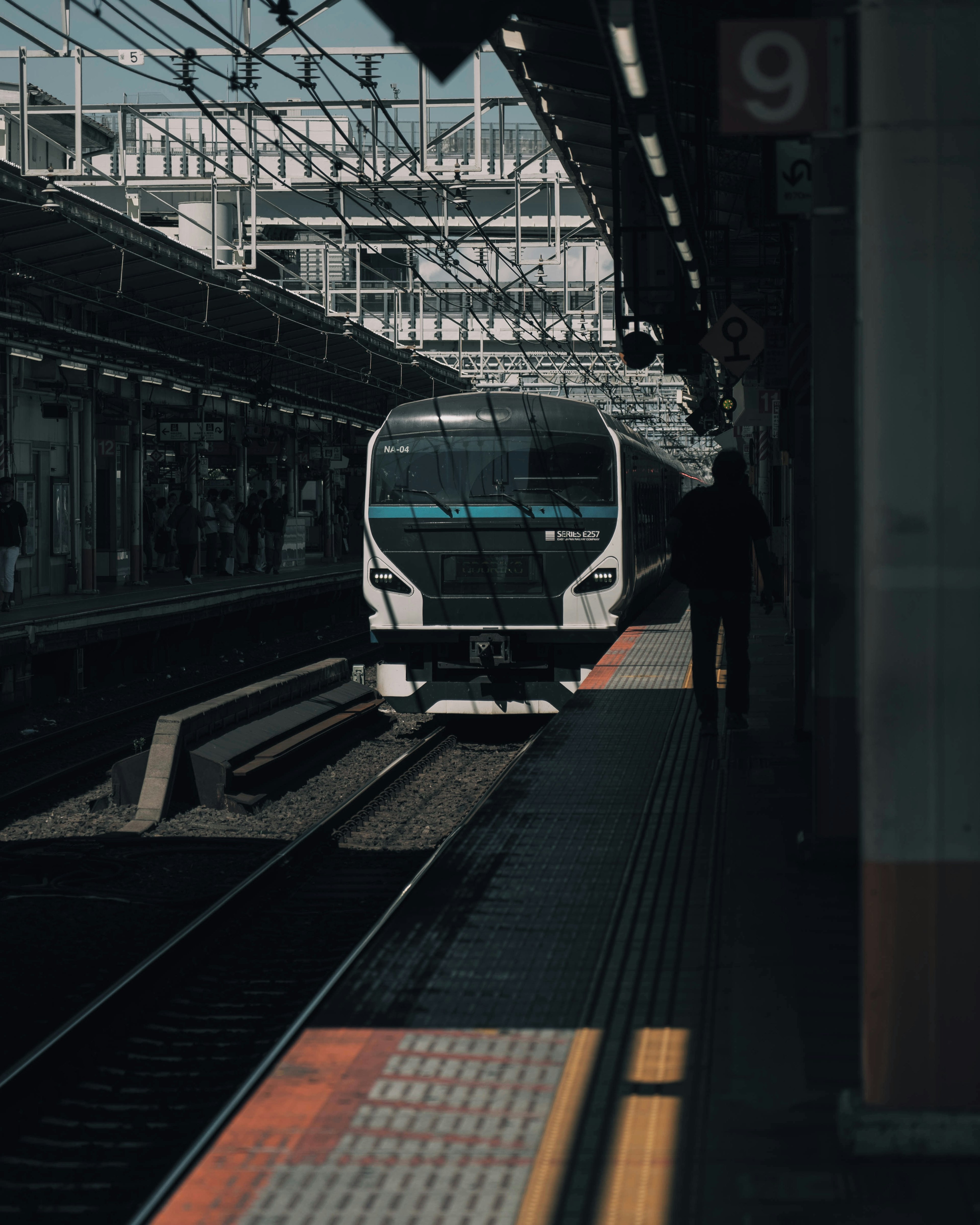 Modern train arriving at a station platform with a sleek design