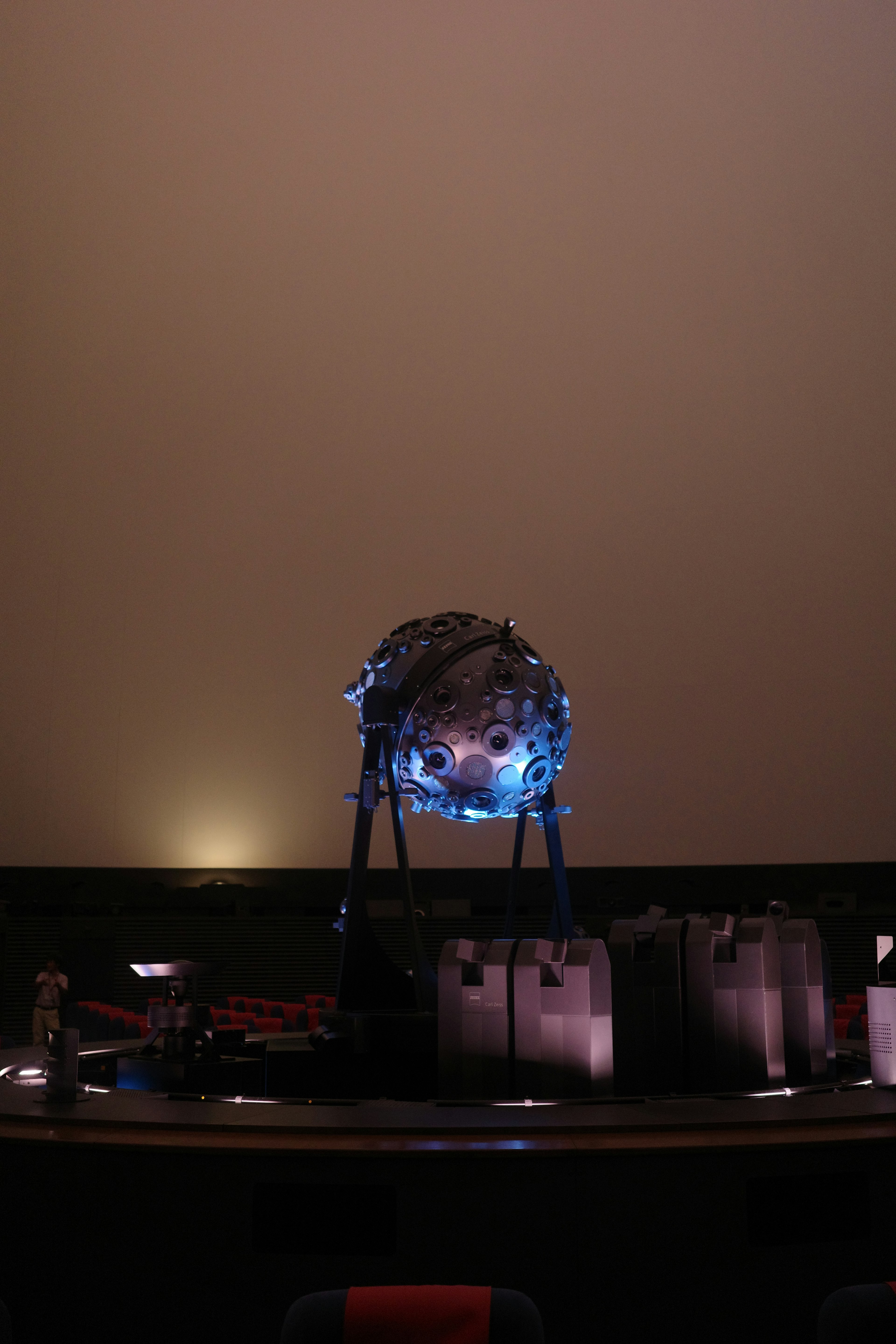 Illuminated celestial model in a planetarium interior