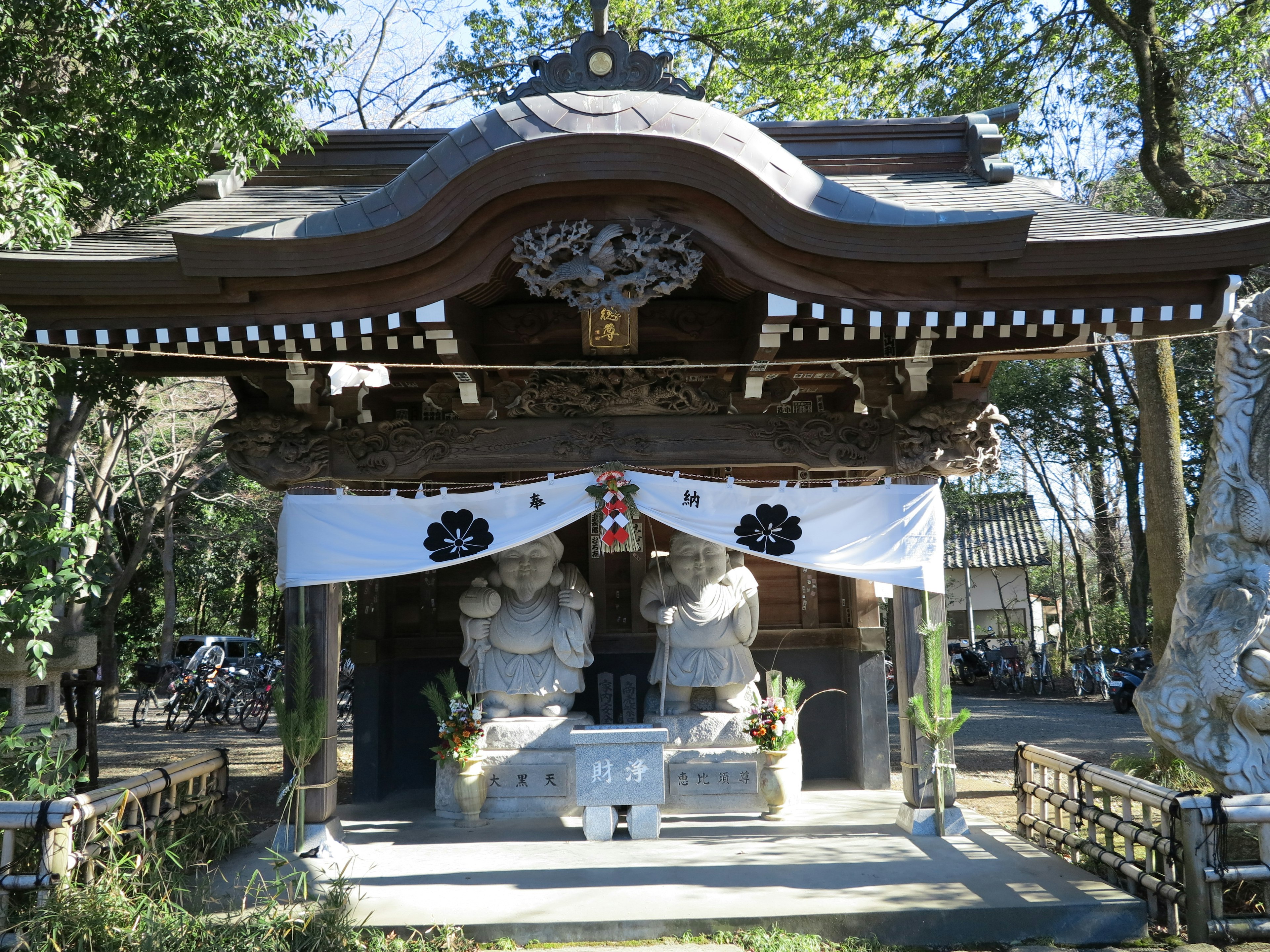 Wooden shrine building with distinctive white curtains