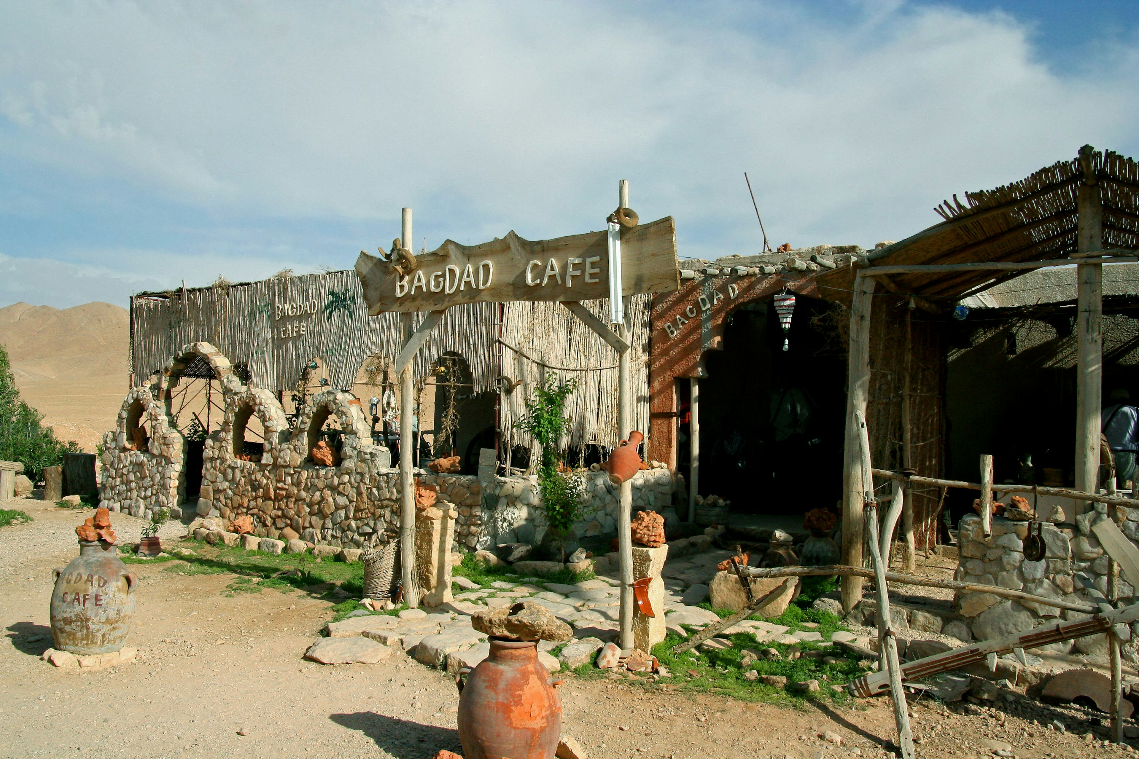 Abandoned café exterior with a handmade sign