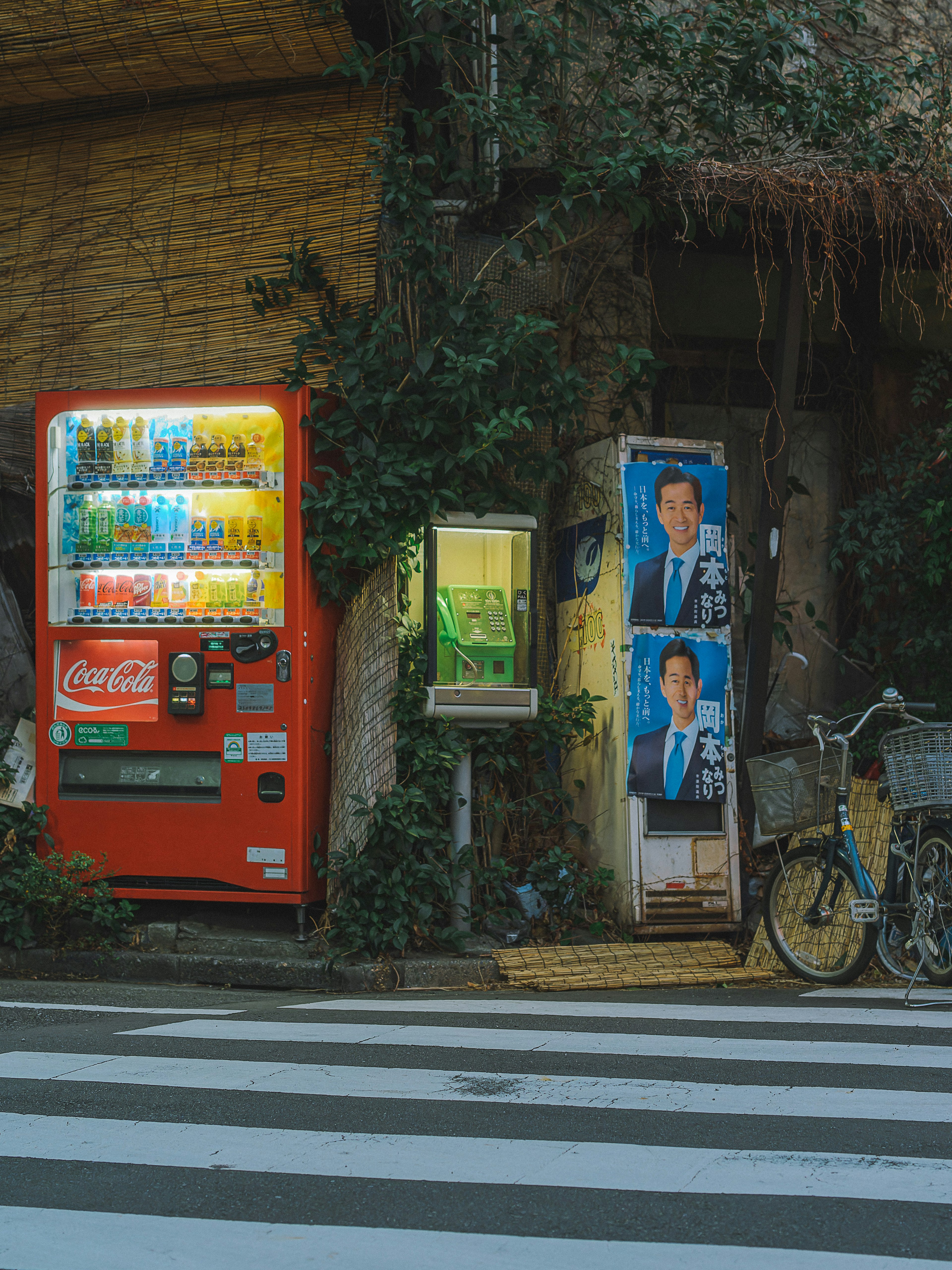 Street corner featuring a vending machine and posters