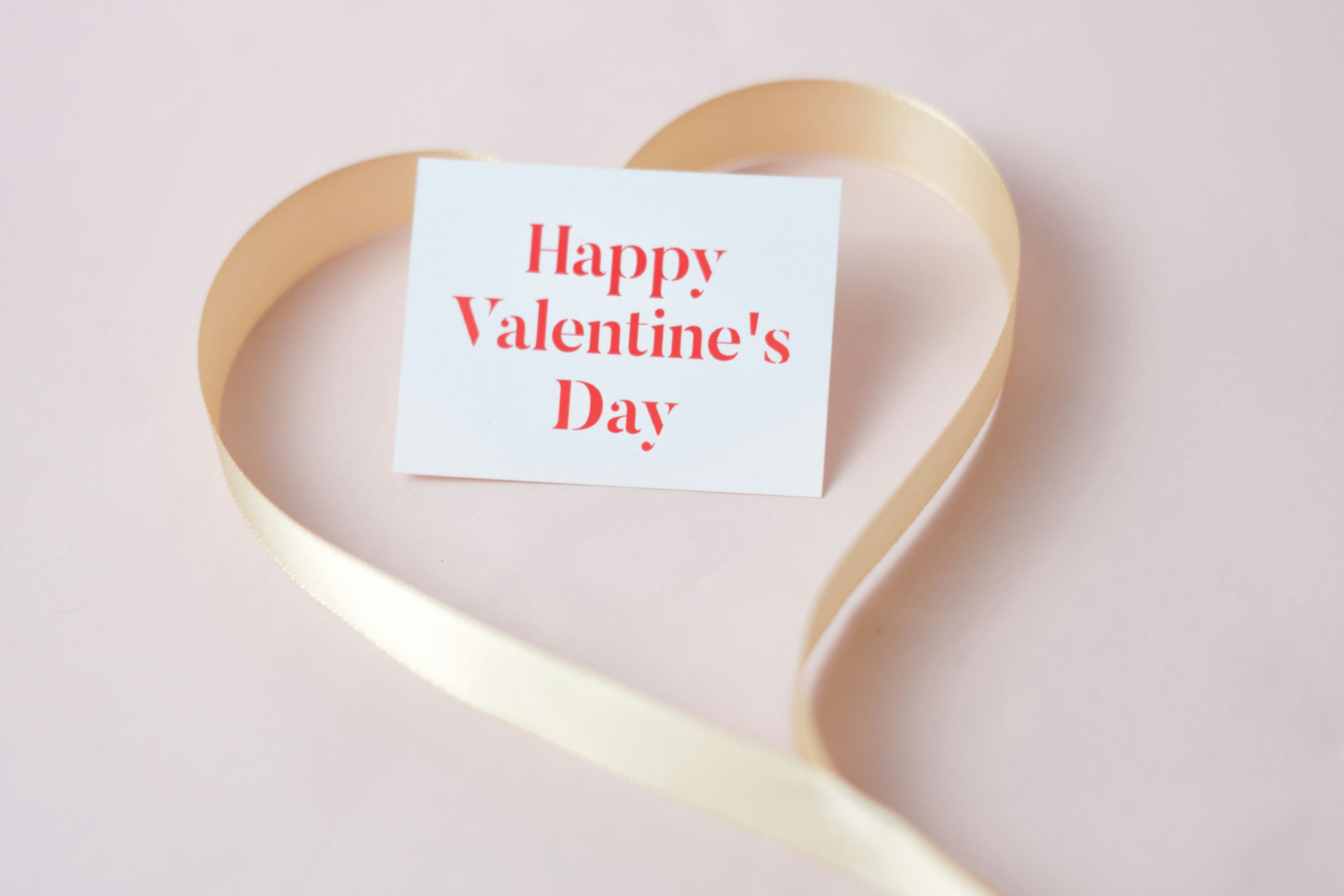 Heart-shaped ribbon with a Valentine's Day message card