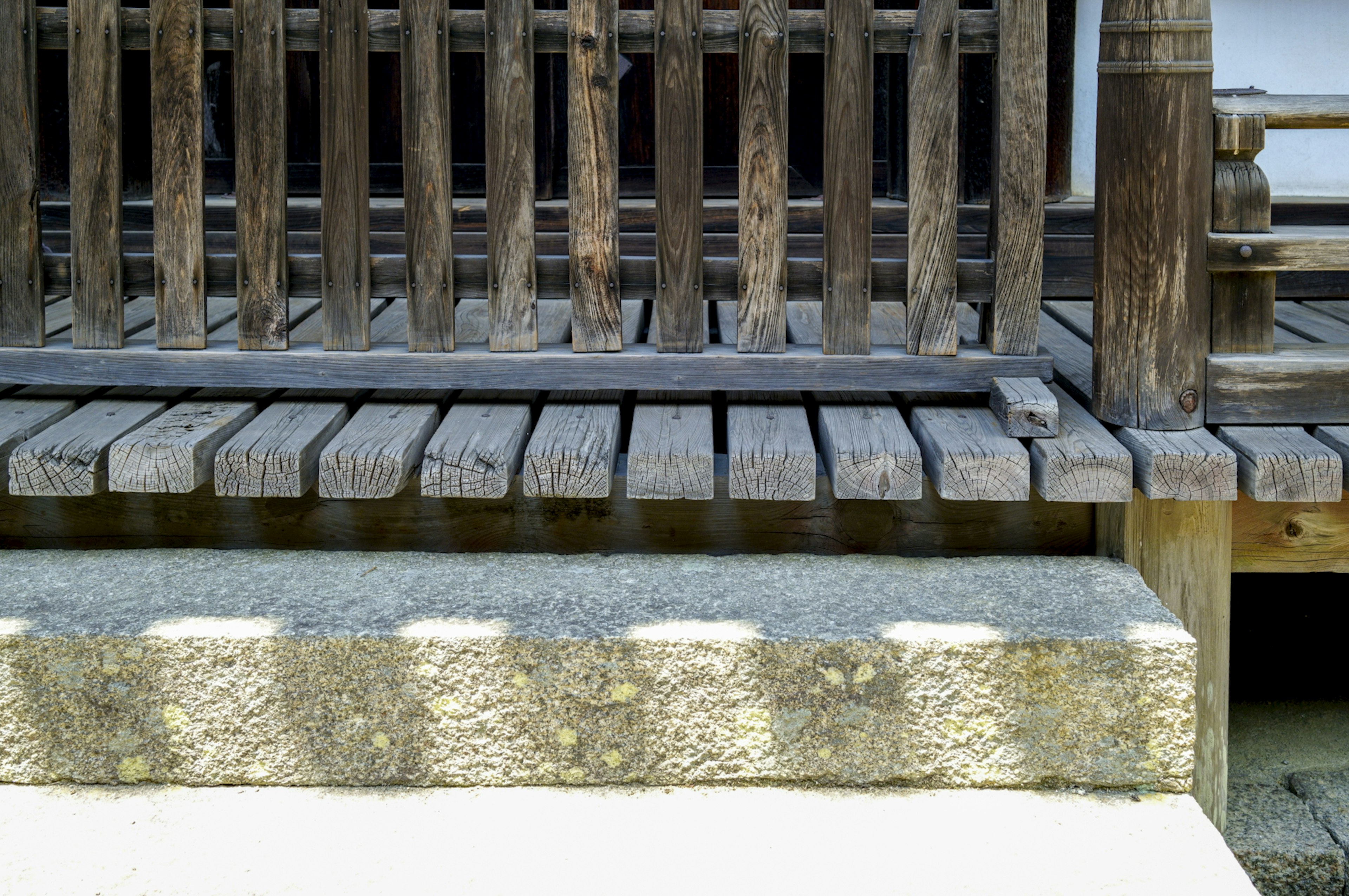 Wooden deck and stone foundation of a traditional Japanese building