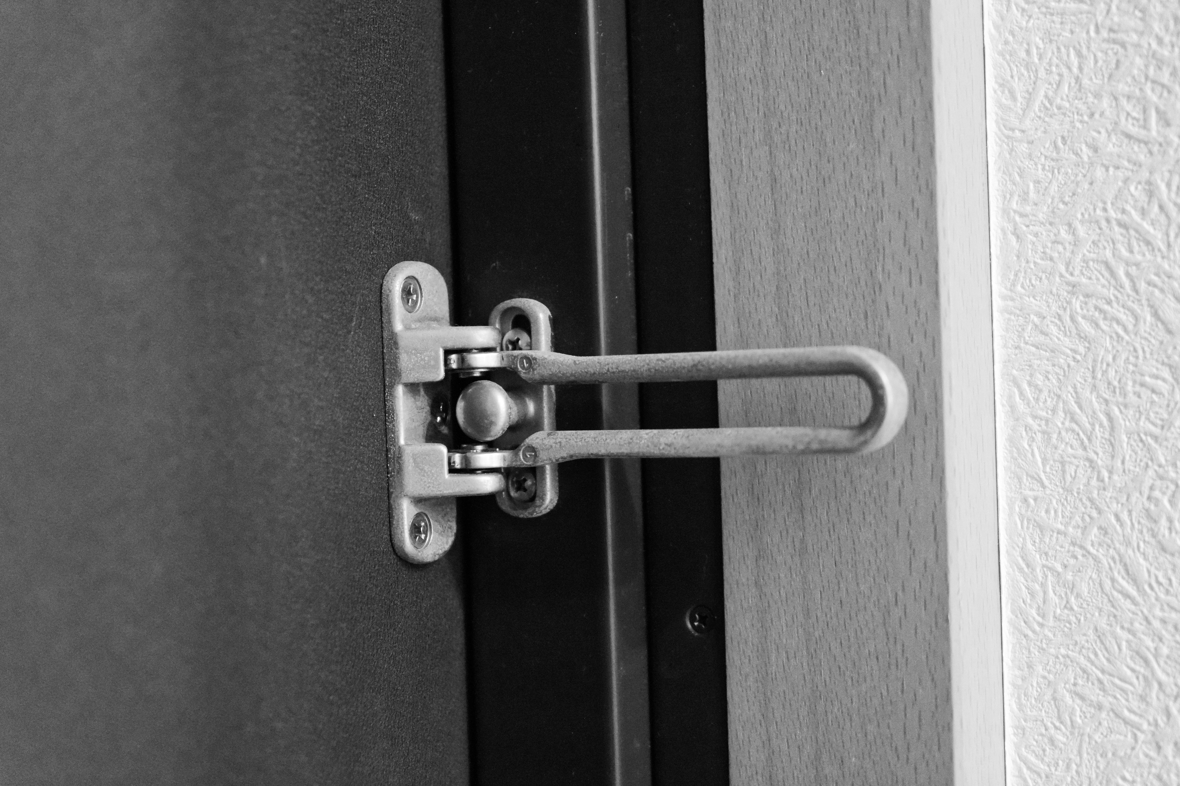 Image of a metal door latch installed on a door