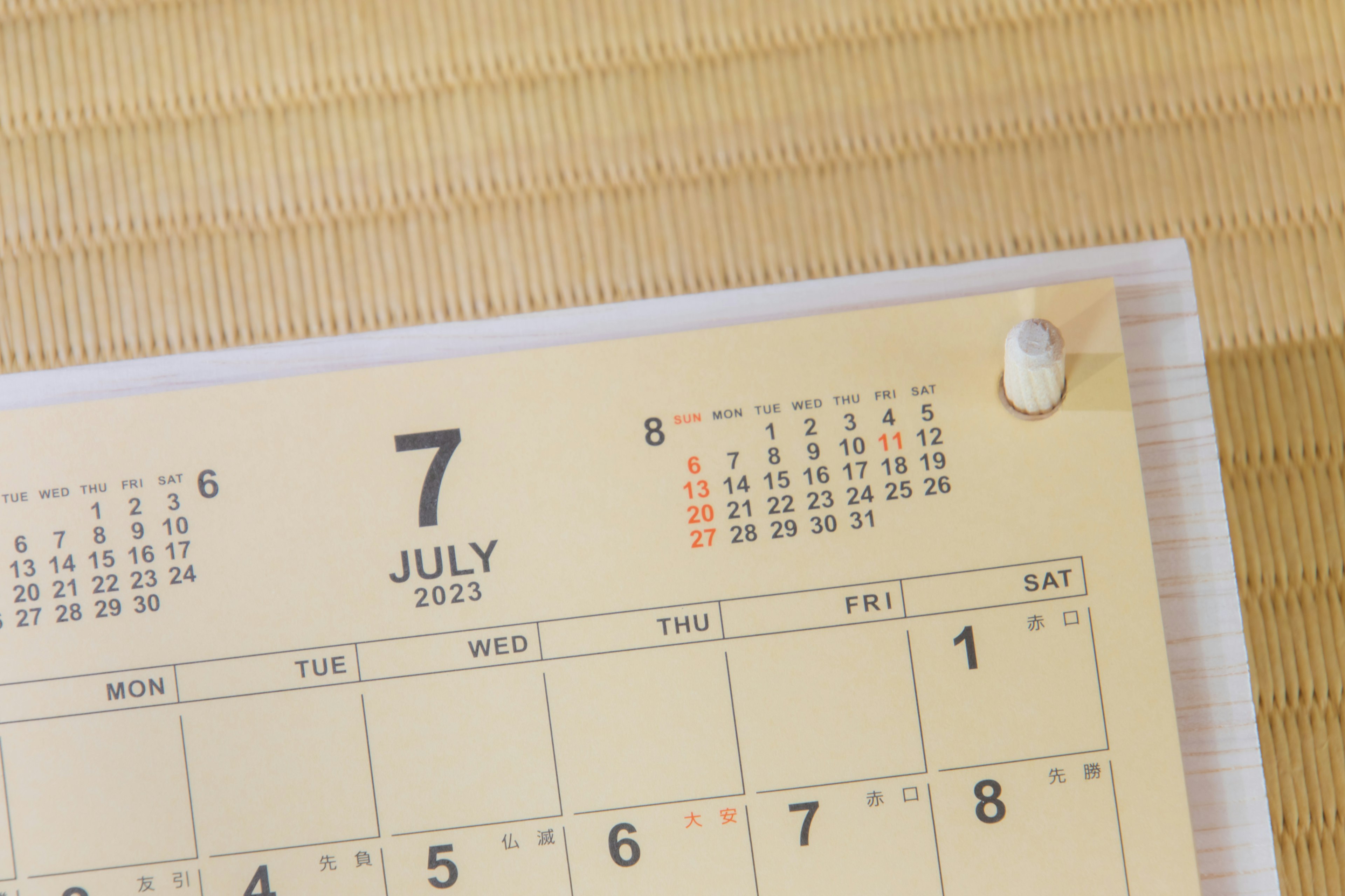 Image focusing on the July page of a calendar