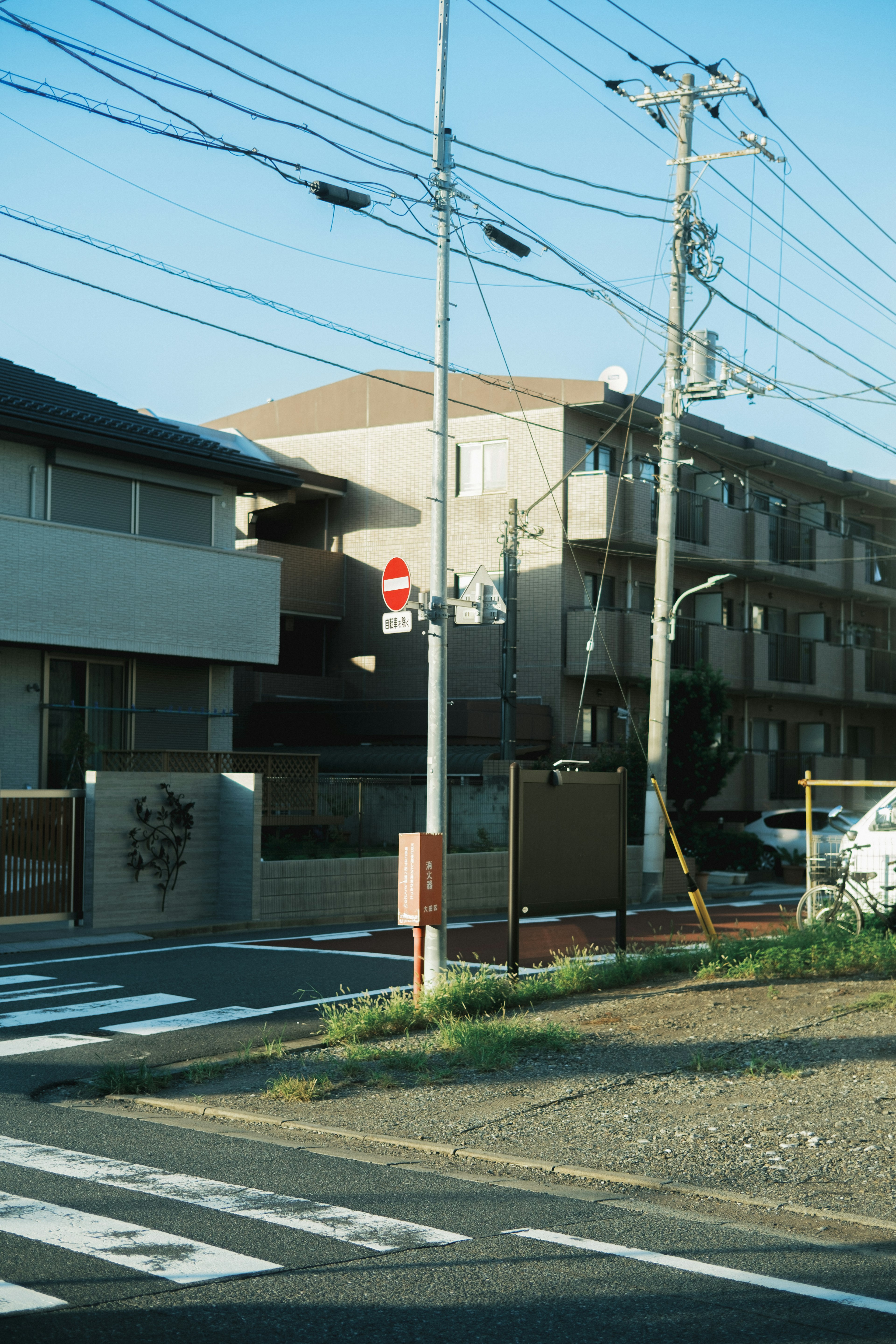 View of residential buildings and utility poles in a neighborhood