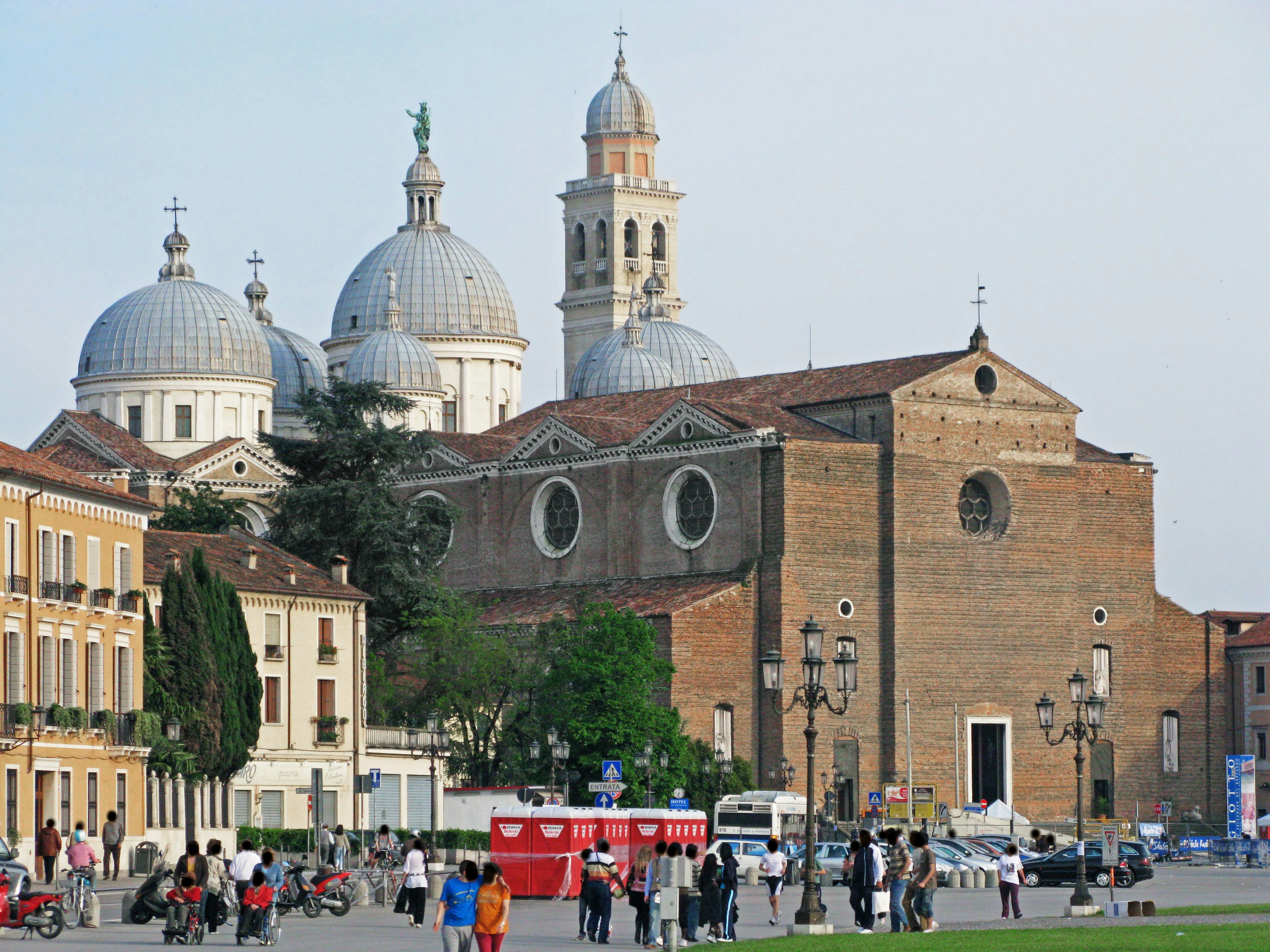 Scenic view of a church with domes and people in a square