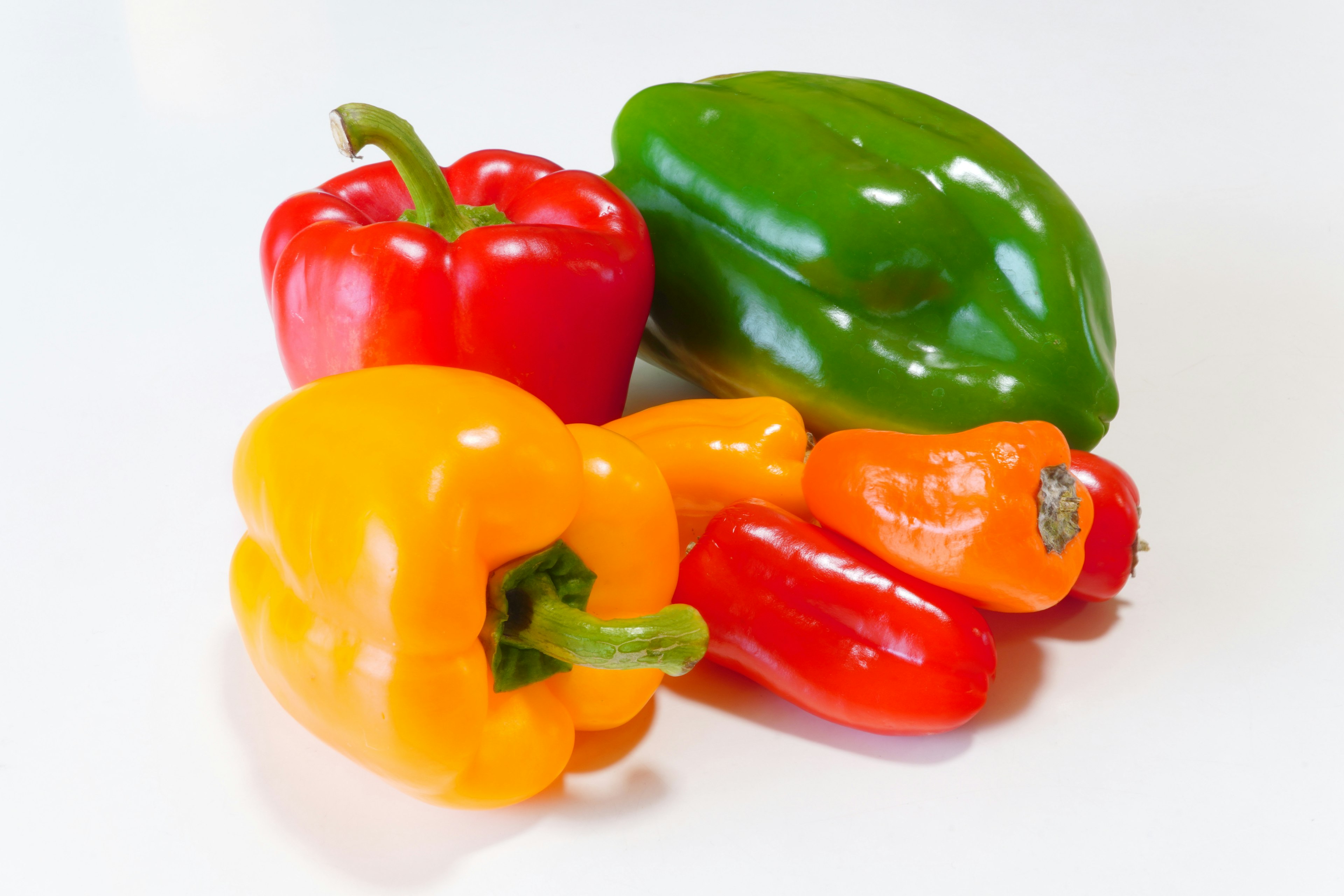 Colorful arrangement of bell peppers and mini peppers