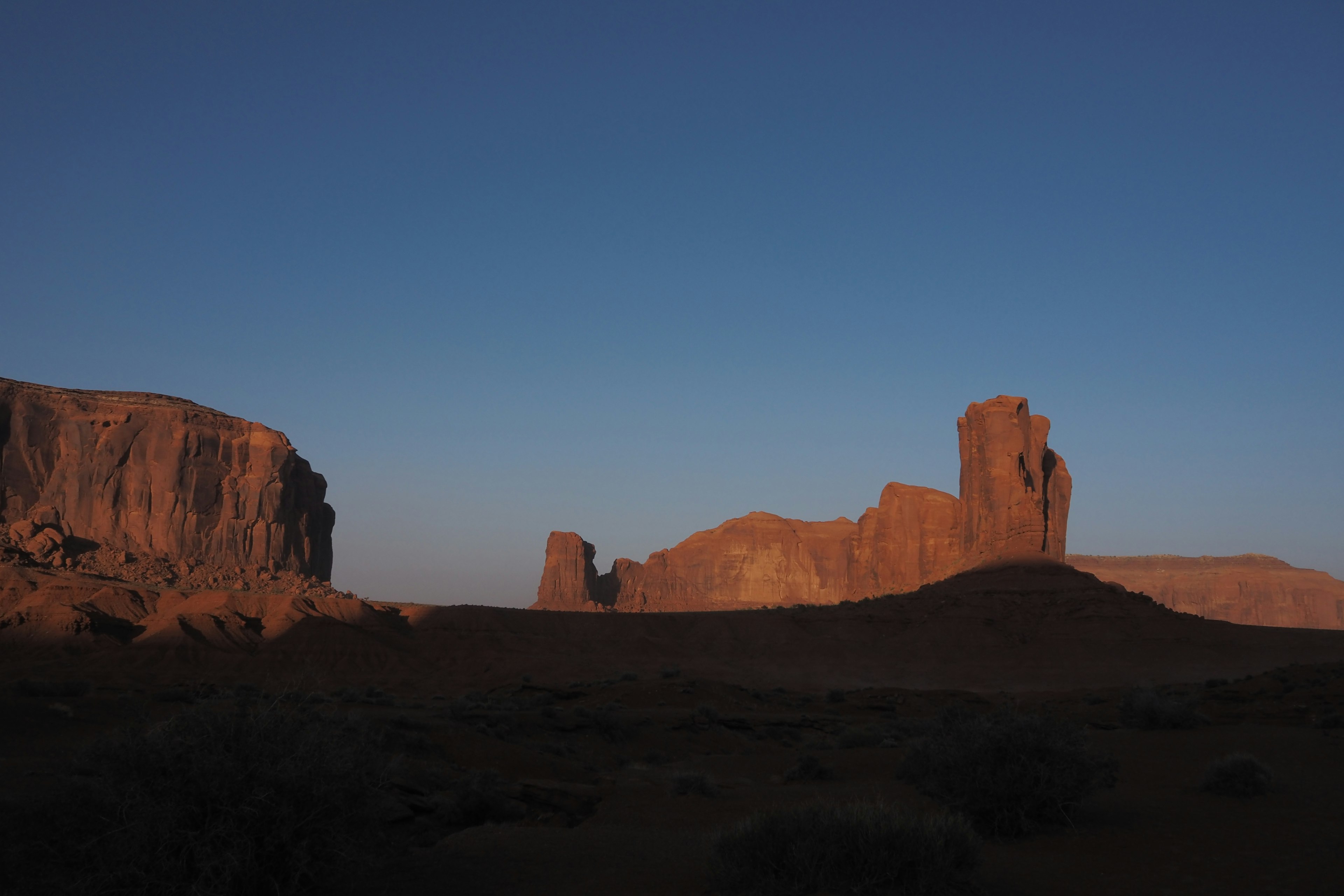 Silhouette of rock formations against a twilight sky