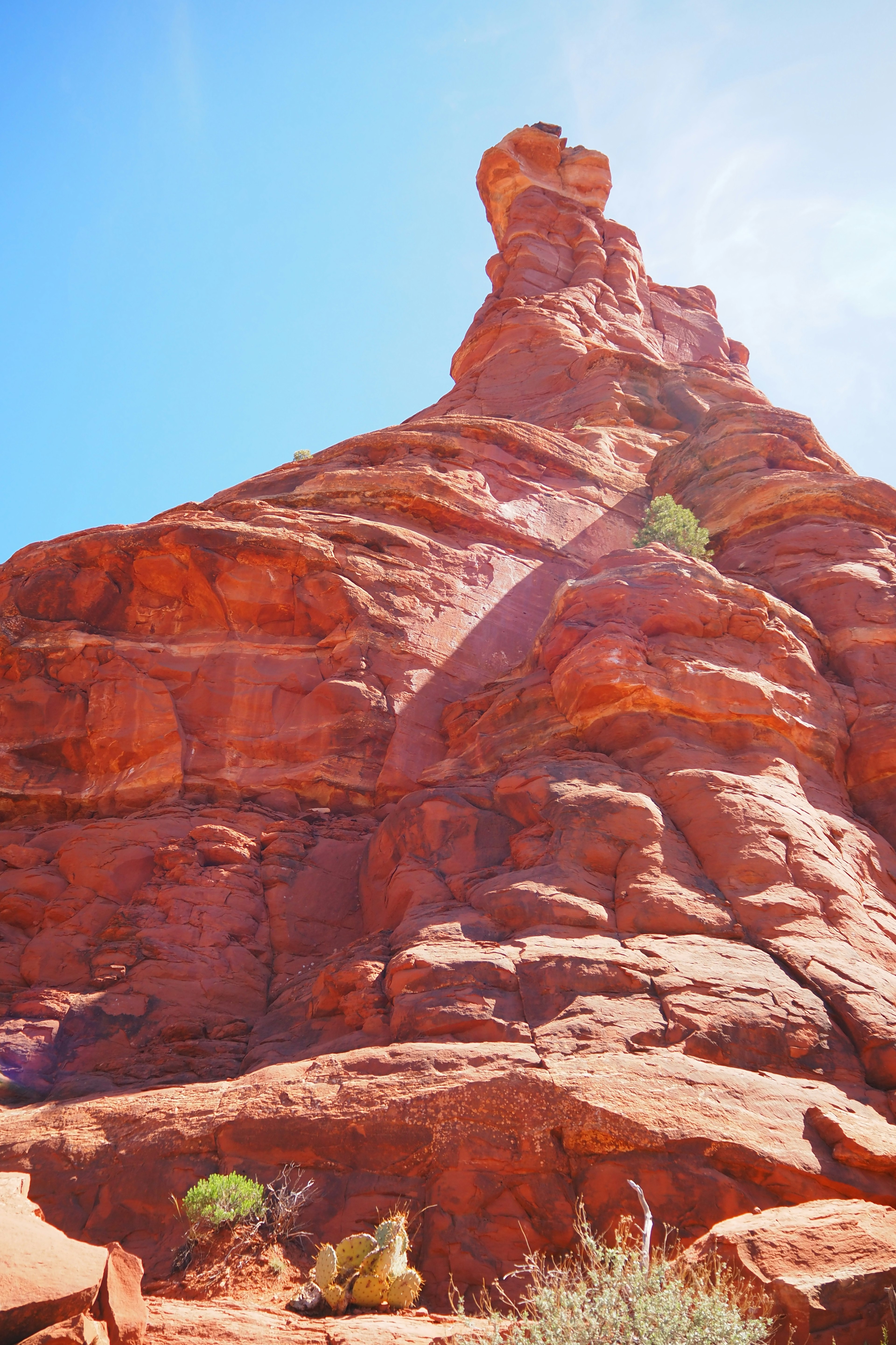 Red rock formation under a clear blue sky