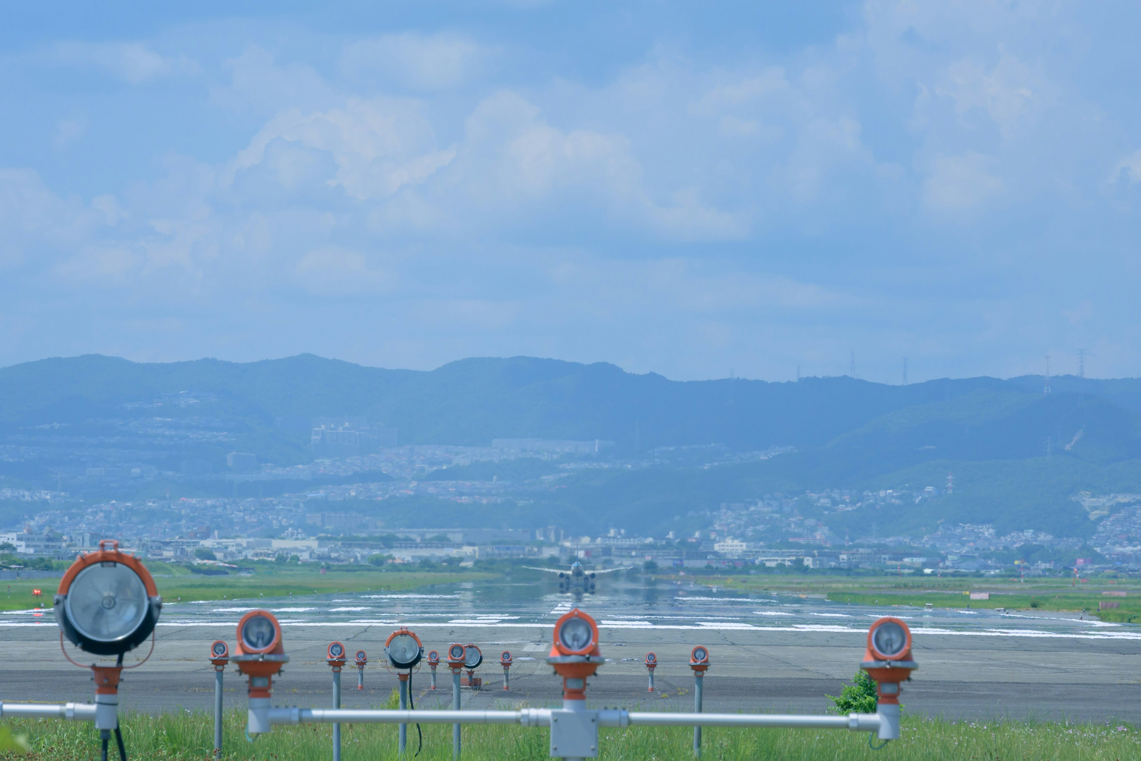 Runway instruments with blue sky and mountains in the background