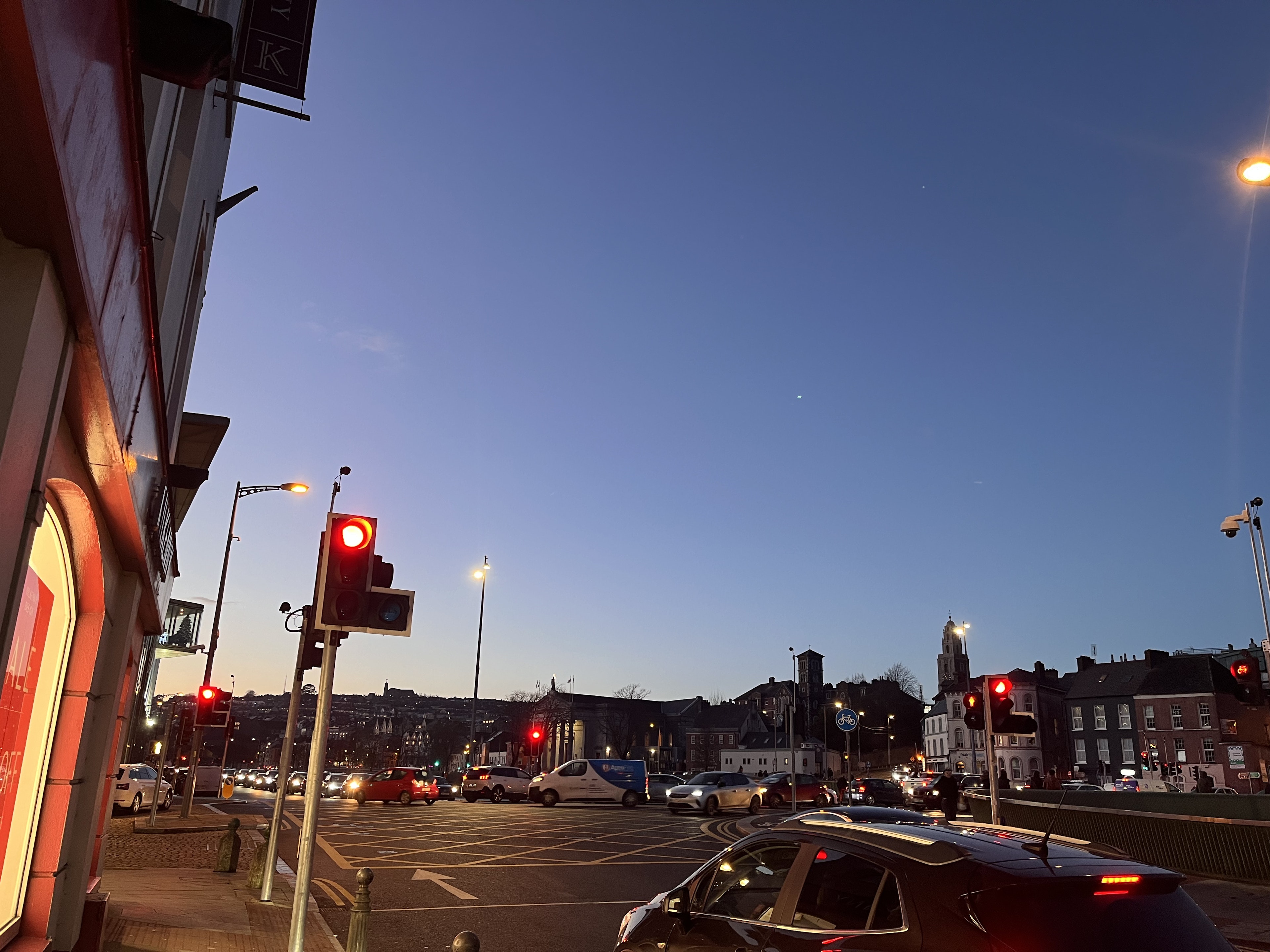 Night cityscape with traffic signals and vehicles