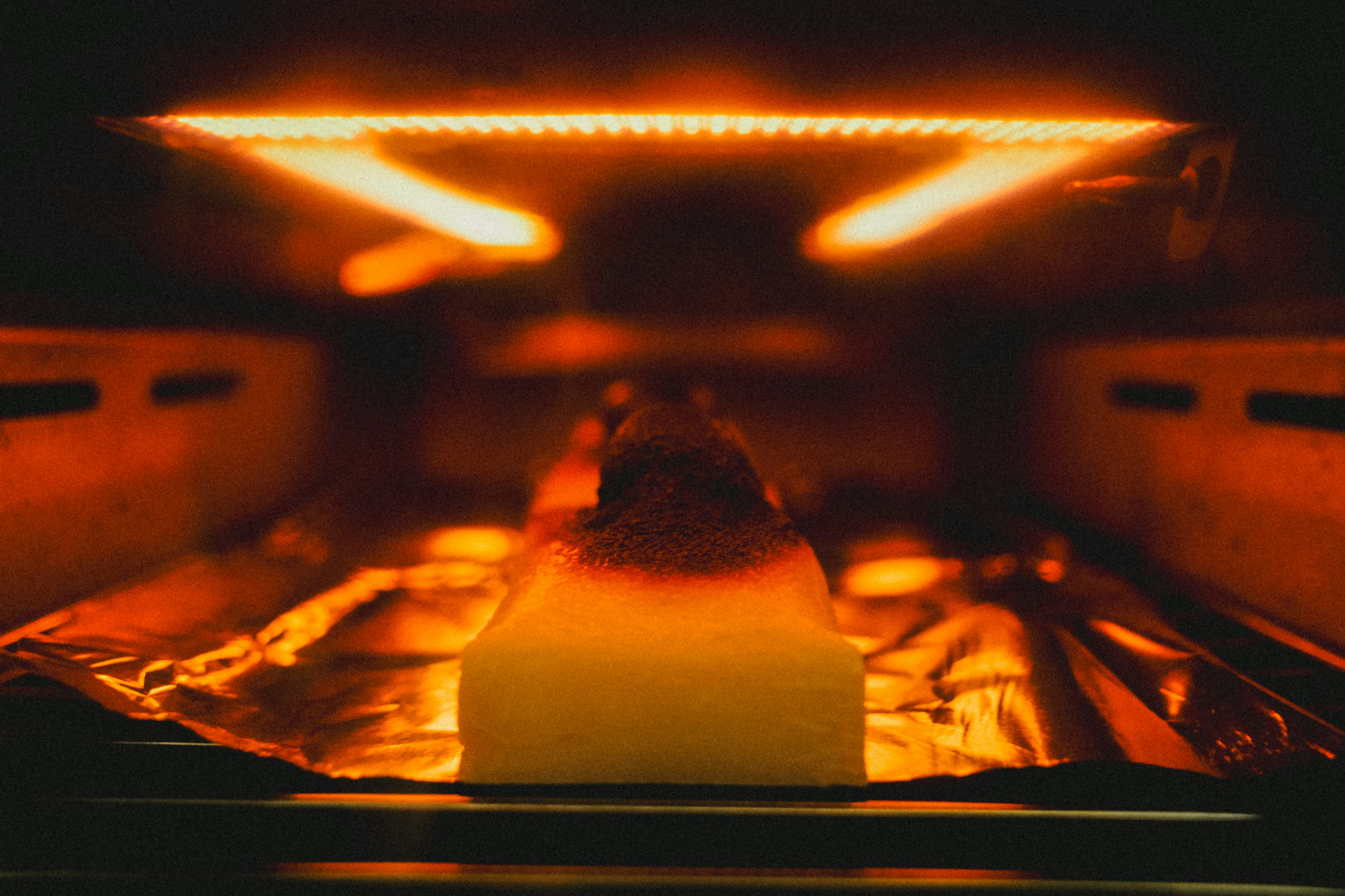 Close-up image of food being baked in an oven