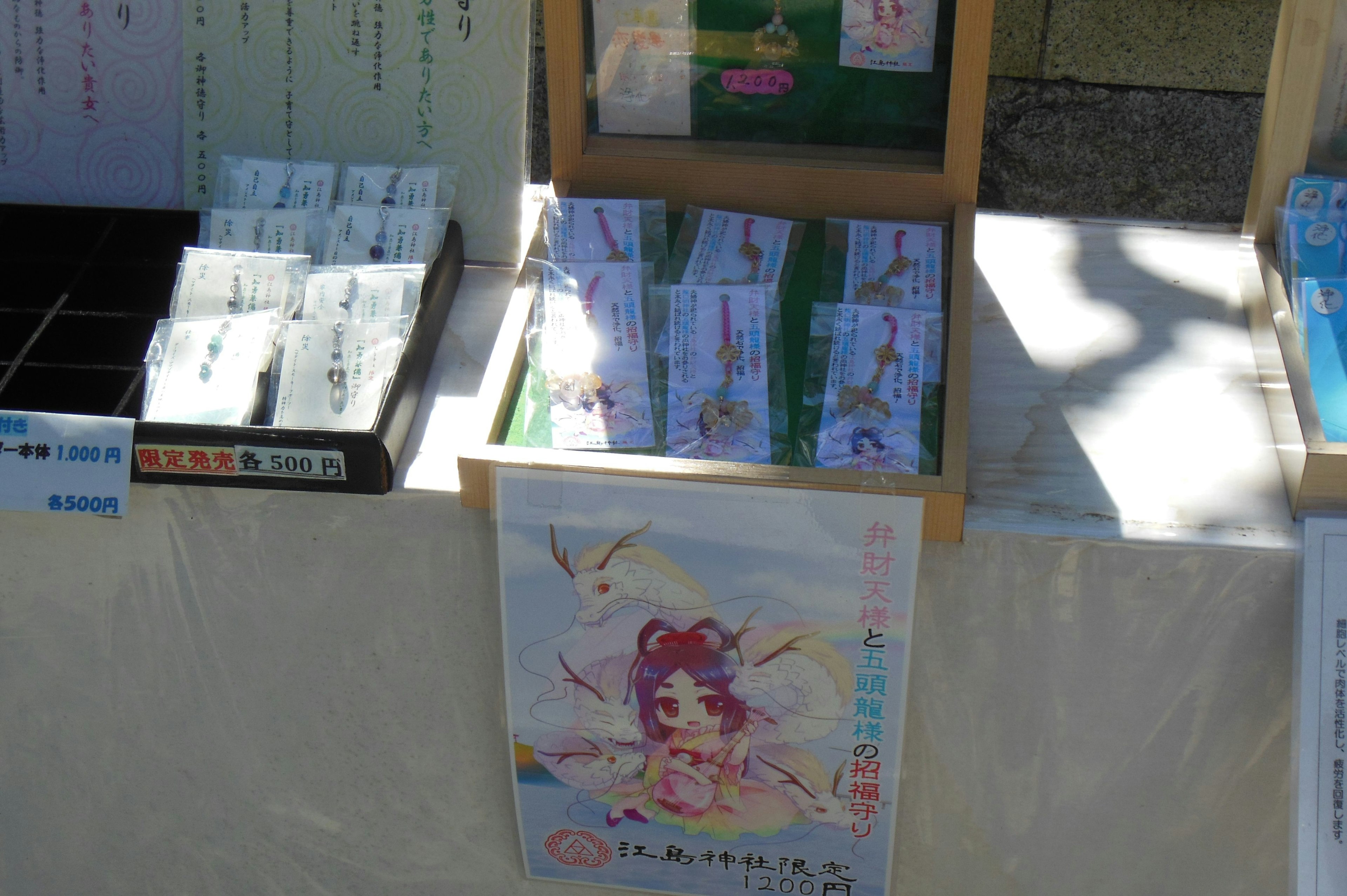 Wooden box displaying various products and colorful designed postcards