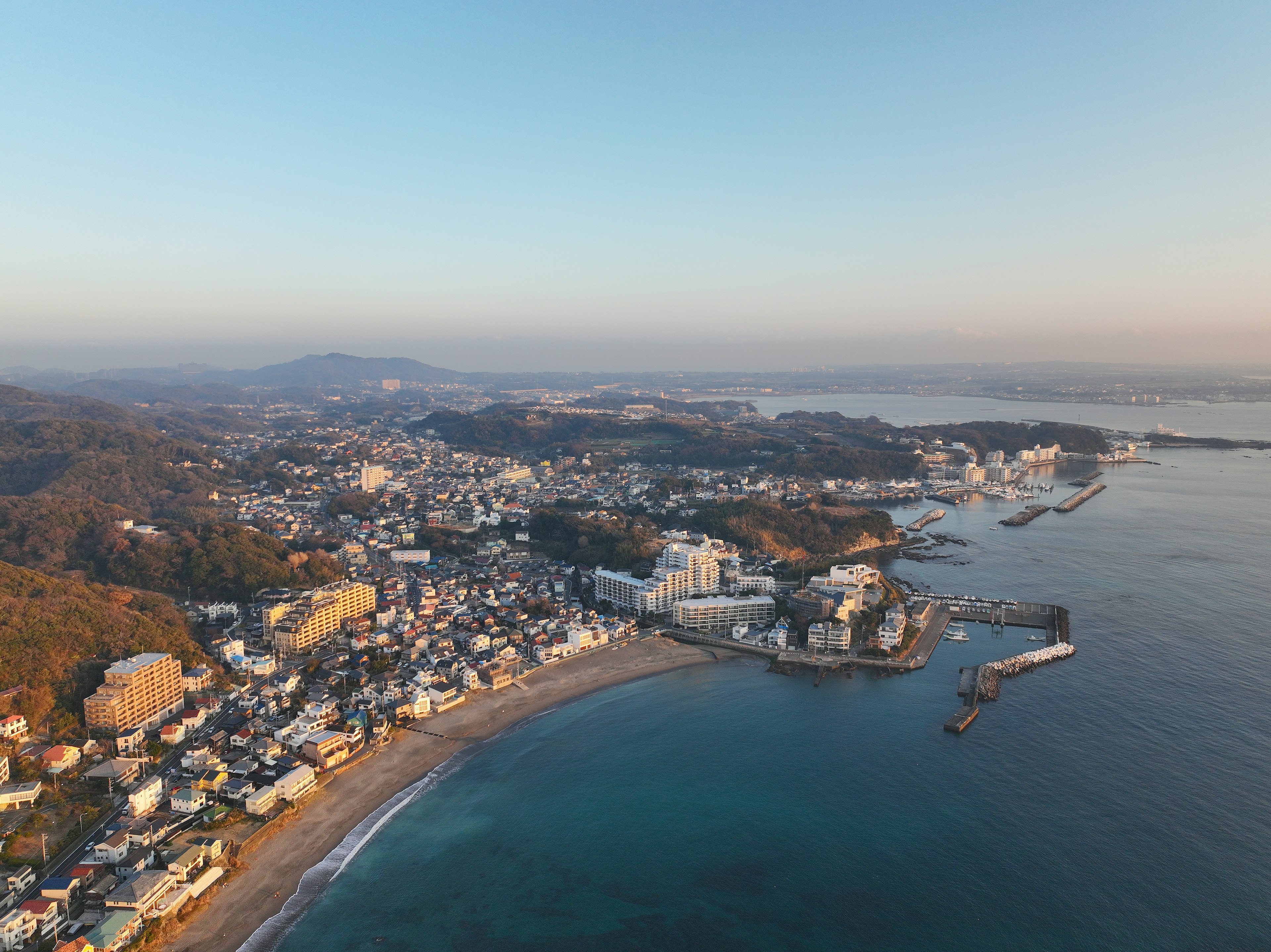 Aerial view of a coastal town with buildings and beach