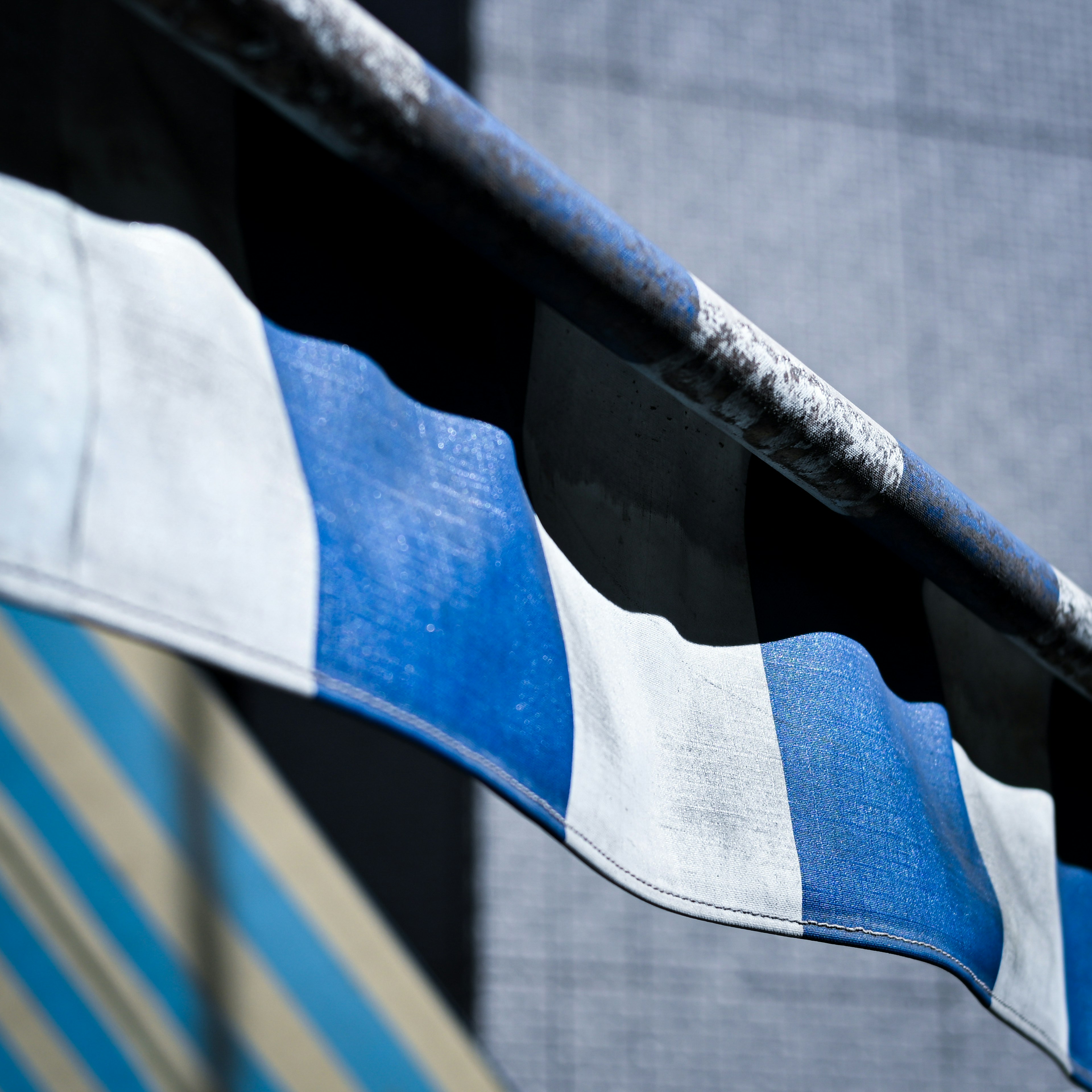 Close-up of a blue and white striped awning