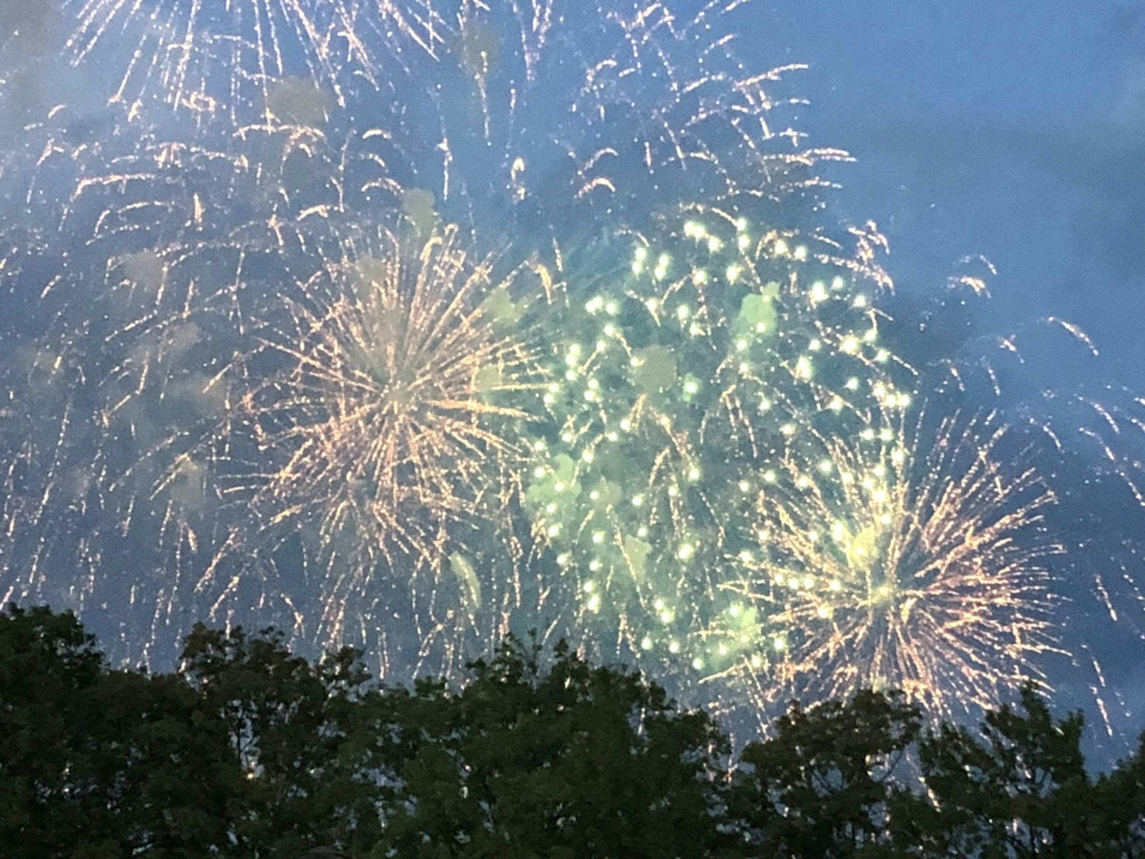 Beautiful fireworks display against a blue sky