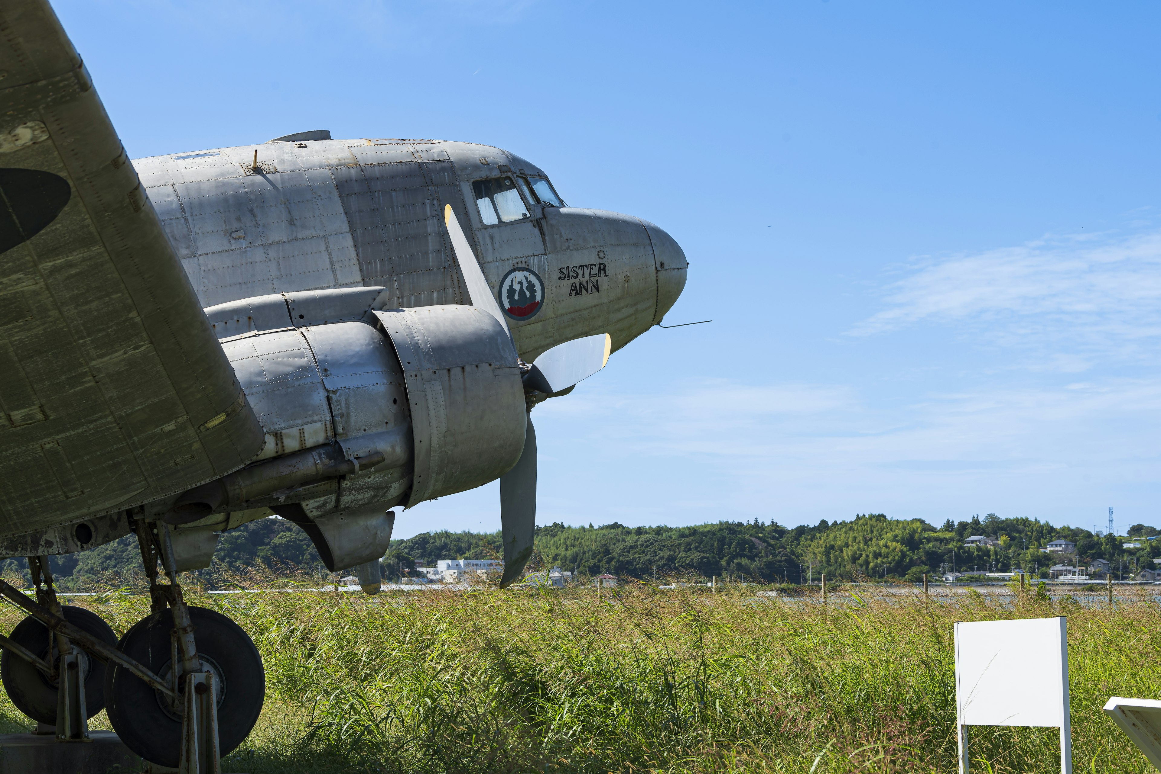 Side view of a vintage aircraft under a blue sky